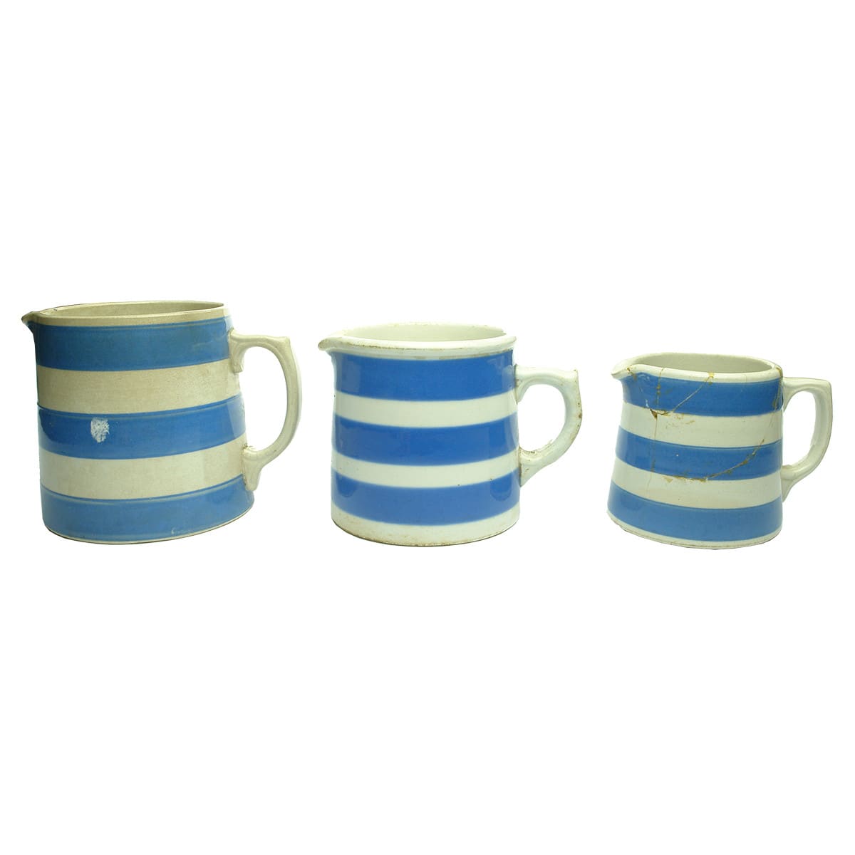 Pottery. Three Cornishware Jugs: Larger Hoffman Ware, Australia; Medium R. Fowler Ltd., Australia; Small Unmarked.