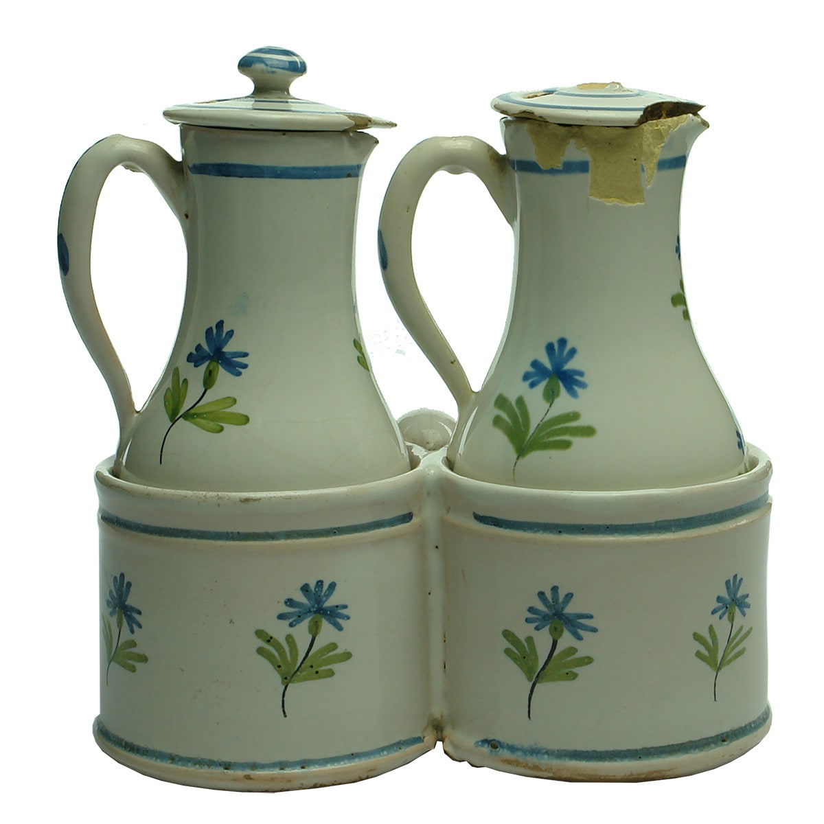 Delft or tin glaze like Sauce or Condiment set. Two bottles and holder Lids. Blue, Green & Black print.