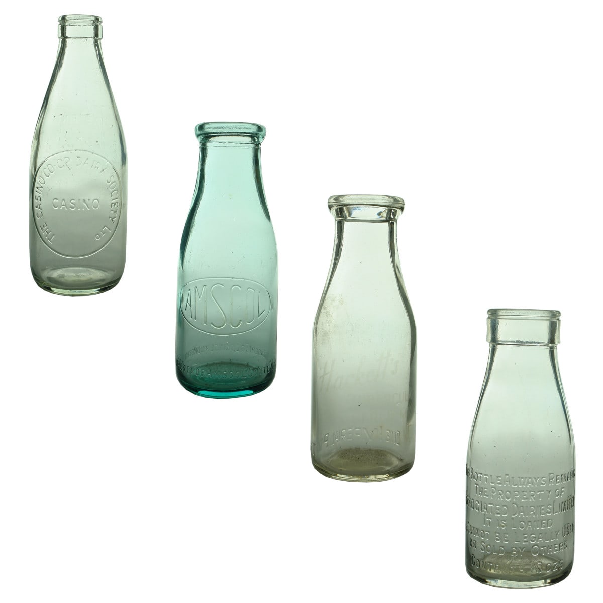 4 Milk Bottles: Casino Co-op Dairy Society; Amscol; Hackett's Castlemaine (ghosted ceramic label); Associated Dairies 10 oz. (Victoria & South Australia)