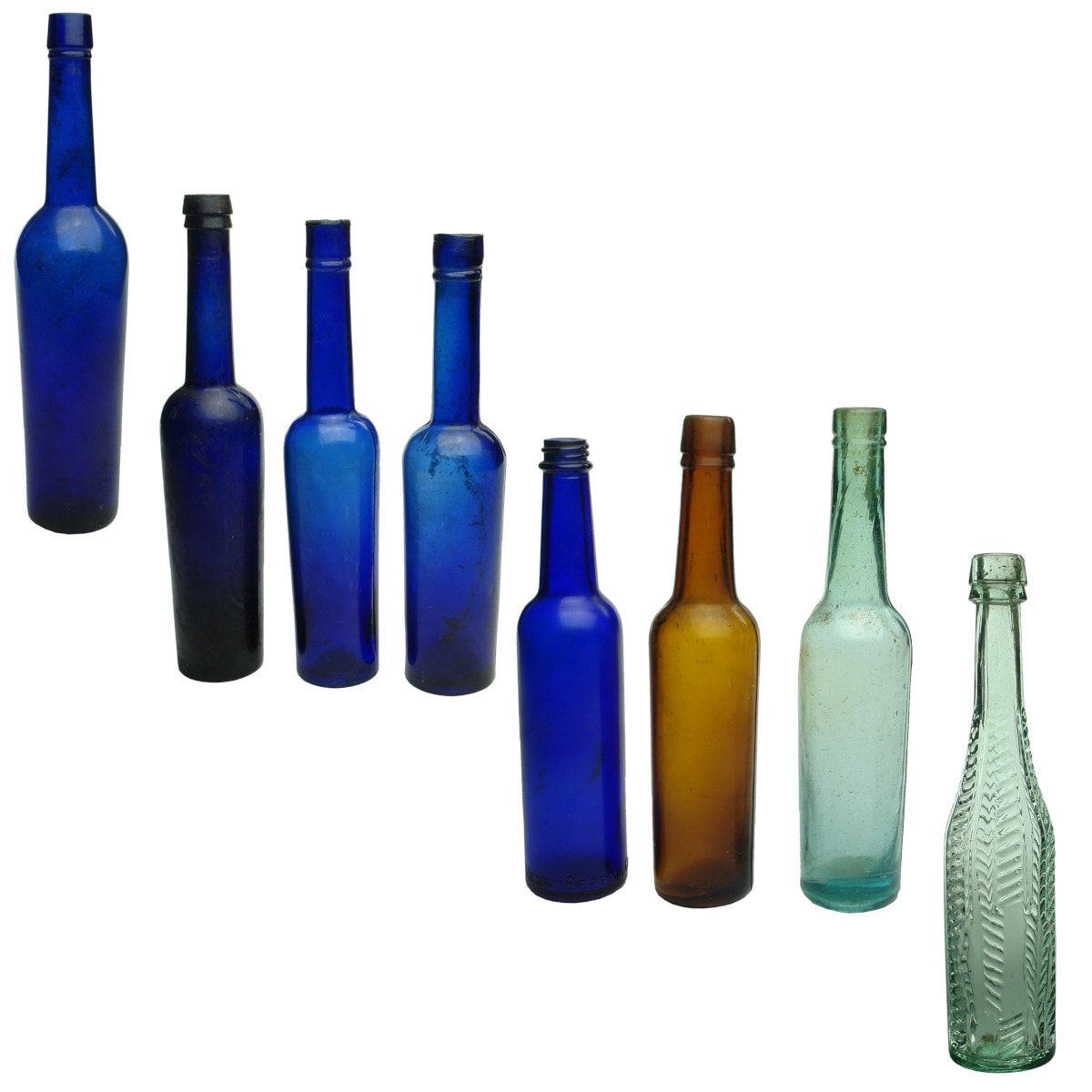 8 Household bottles . 7 x castor oils: Cobalt 10 oz; 3 cobalt 5 oz; screw top cobalt Henry Berry, Melbourne, 5 oz; amber 5 oz; aqua 5 oz; Small Herringbone Oil.