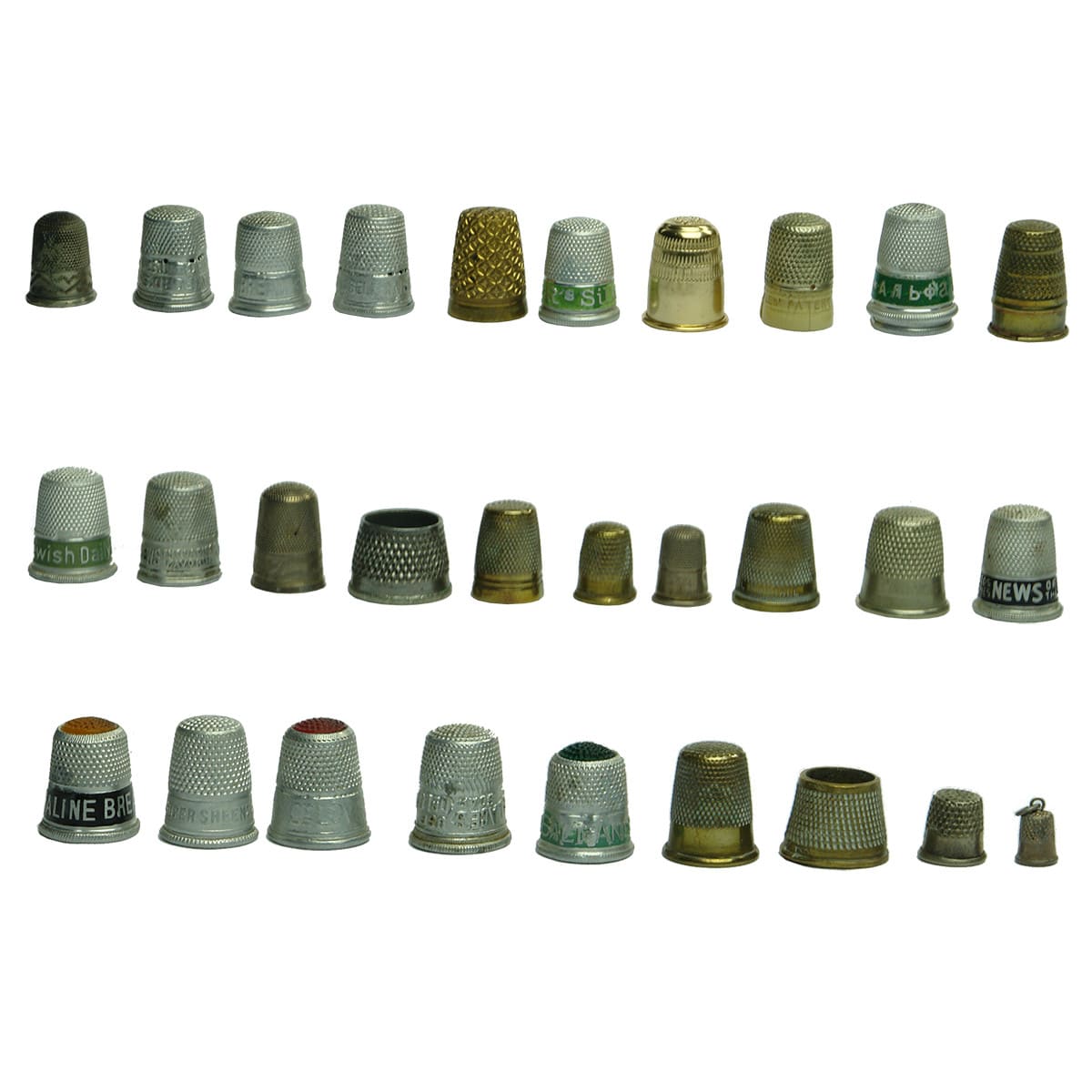 30 Thimbles. Some with advertising. Brass & White Metal. Some miniature ones.