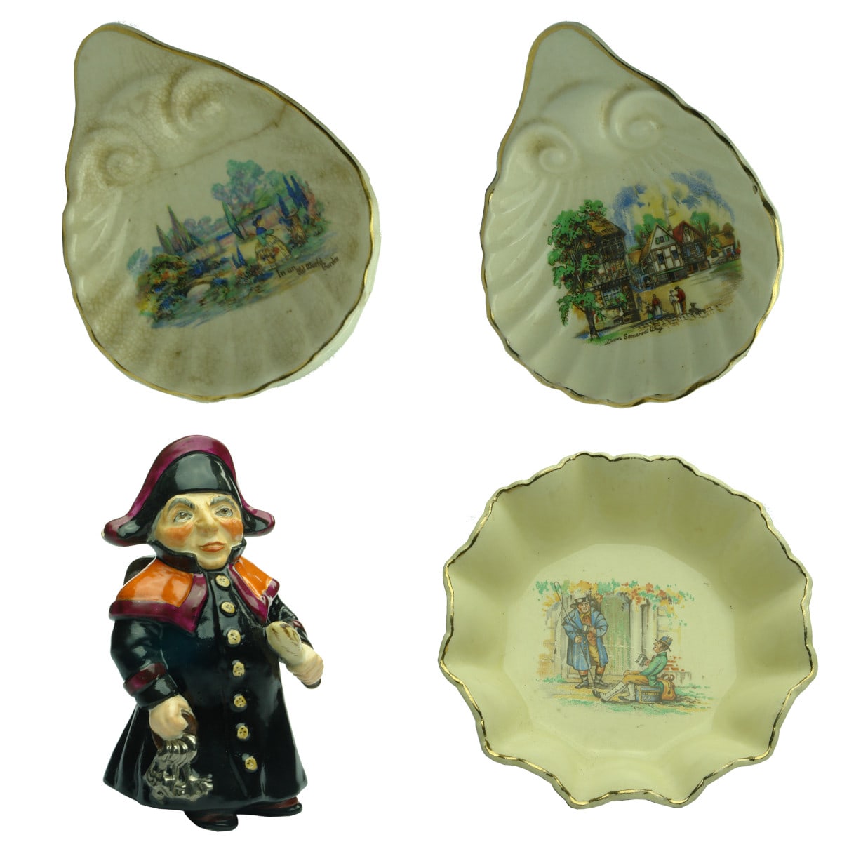 4 Pottery pieces: 1. & 2. Pair of Scallop shaped Butter dishes. Sandland Ware. Hanley Staffordshire. 3. Wedgwood Toby Jug Jailer. 4. Meakin Dickens figures Dish.