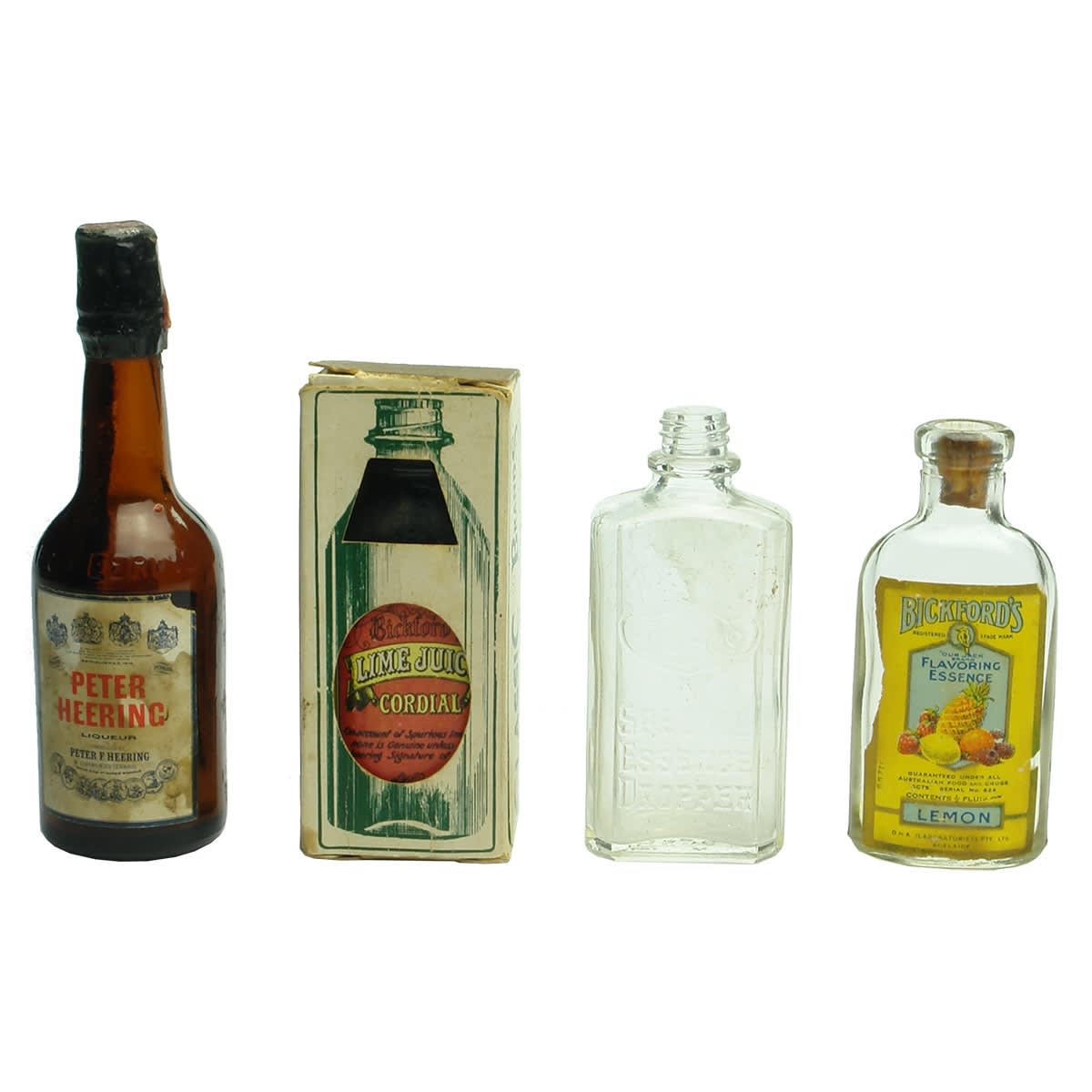 Four Sample/Essence bottles: Peter Heering; Modern Bickfords Lime Juice Cordial; Rolfe's Essence; Bickford's Lemon Essence.