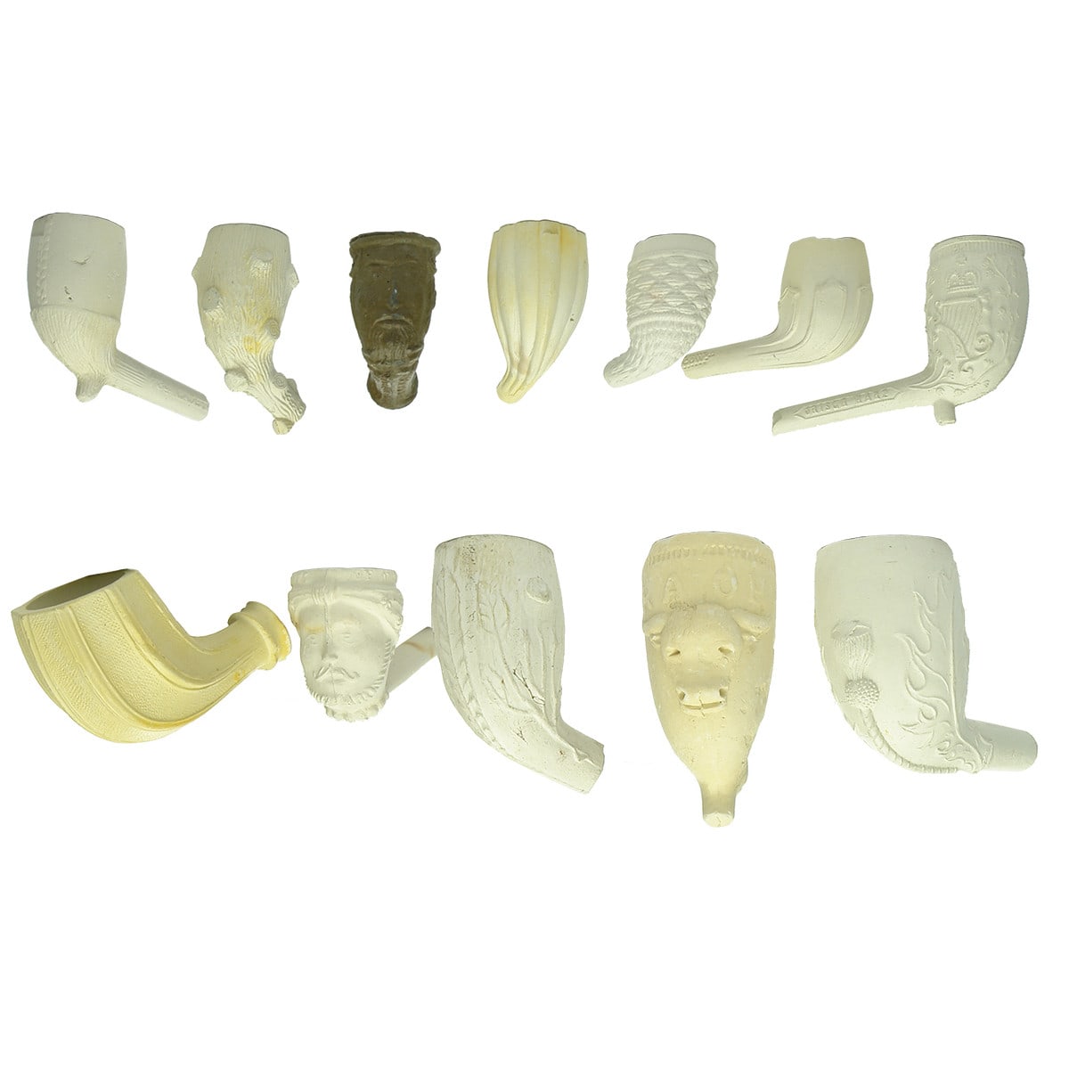 12 different figural clay pipe bowls.