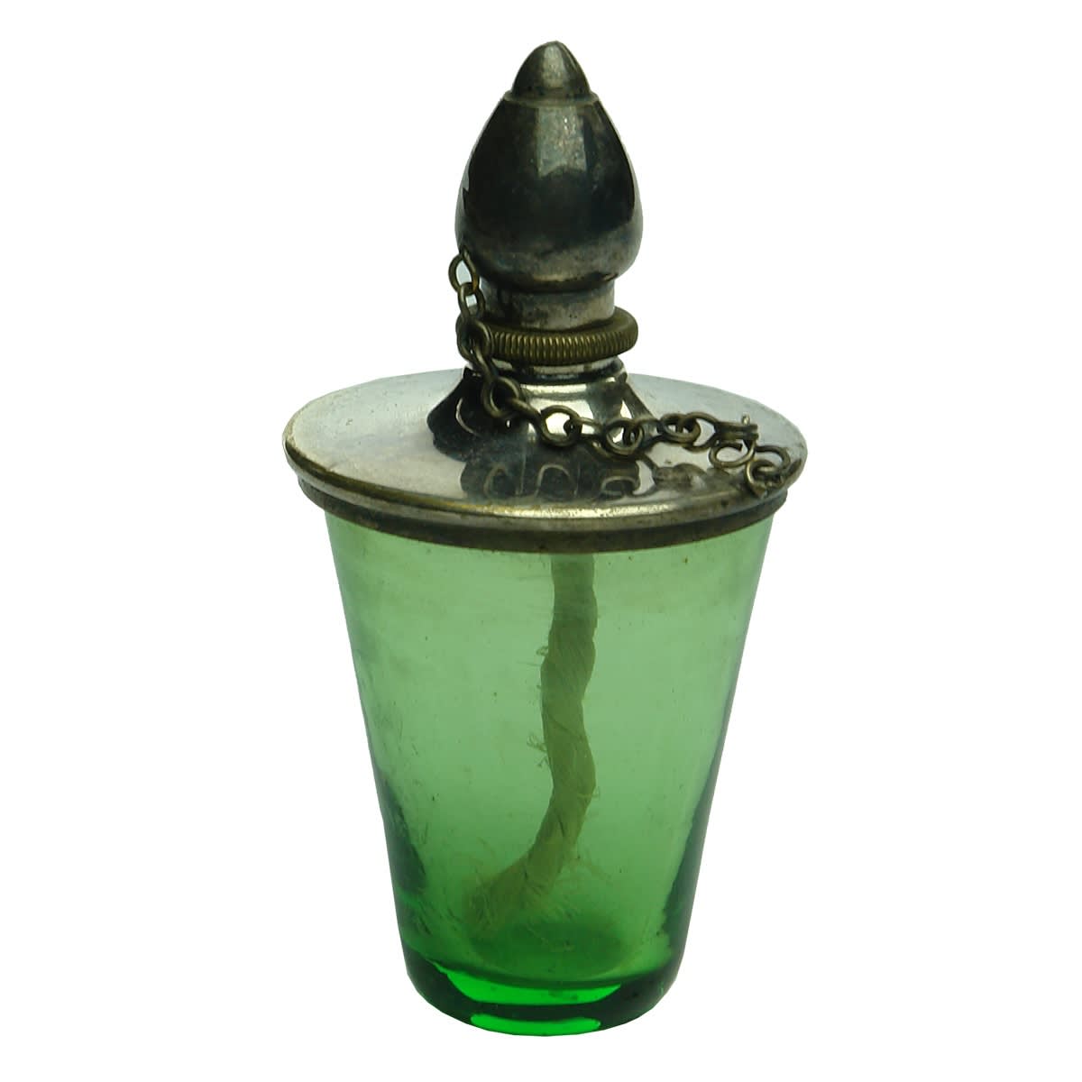 Tiny personal lamp. Green glass body. Metal cap with screw in wick arrangement and cap on a chain.