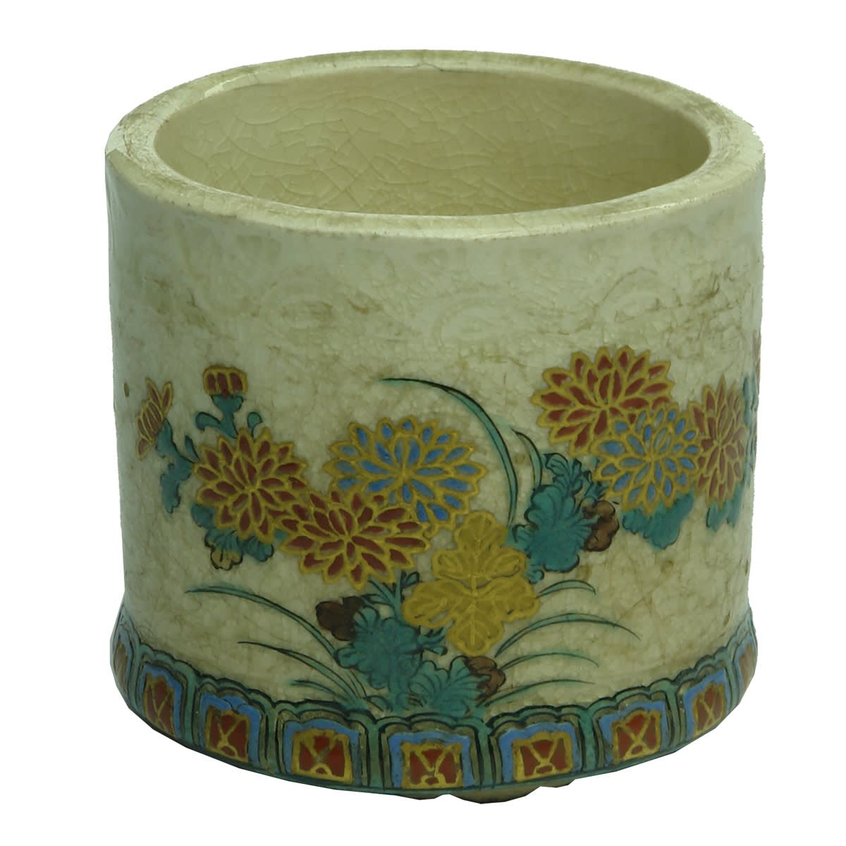 Round pottery cup with enamel like raised and coloured decoration.