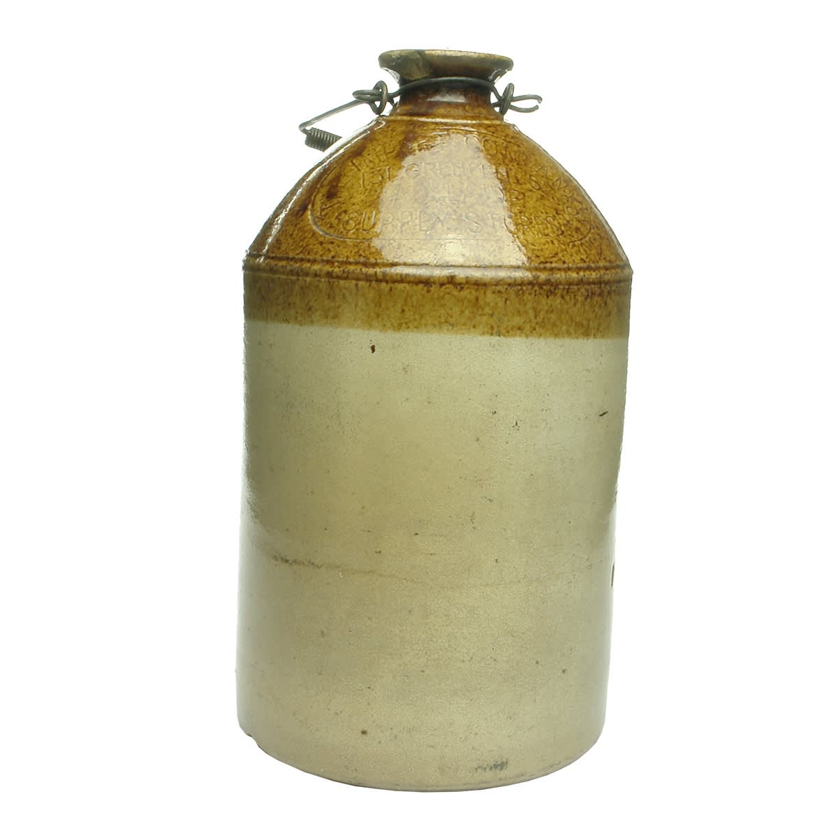 Demijohn. The Import Company's Supply Stores, Adelaide. Tan Top. Impressed. 1 Gallon. (South Australia)