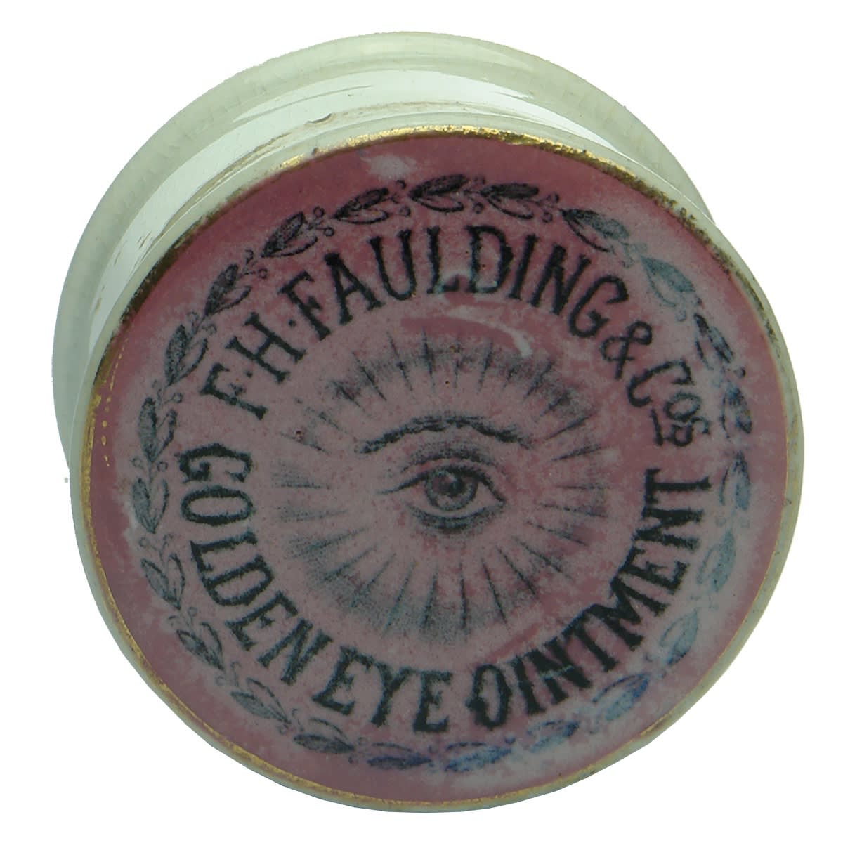 Pot Lid. F. H. Faulding & Cos, Golden Eye Ointment. Black on Pink. Gold band. (South Australia)