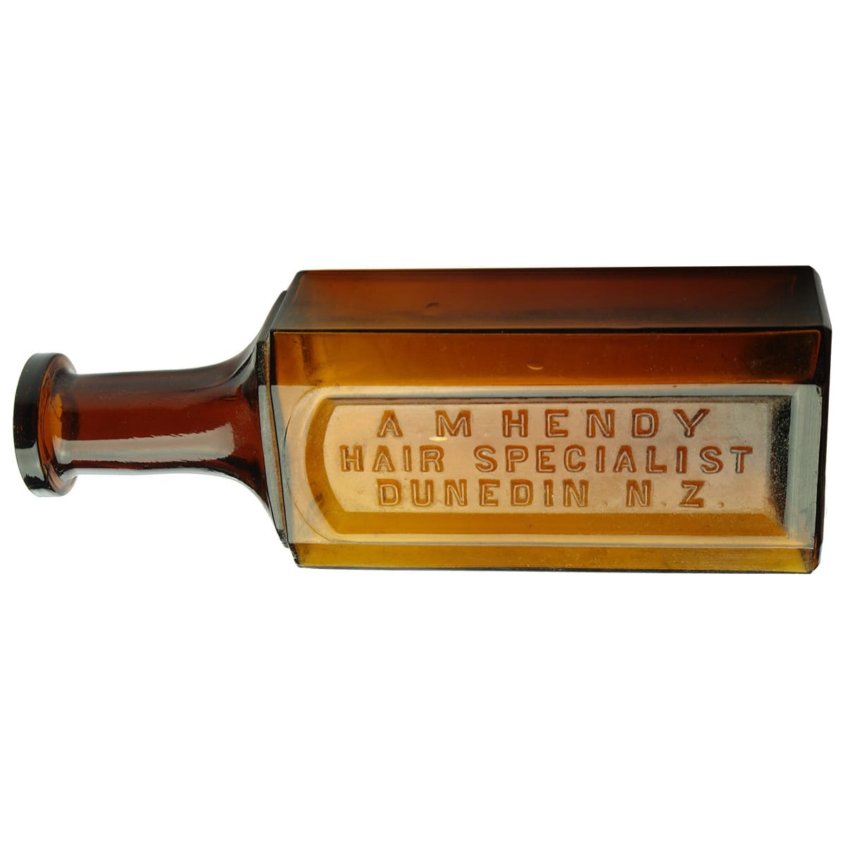 Medicine. A. M. Hendy Hair Specialist, Dunedin, N. Z. W. T. Co. Amber. 8 oz. (New Zealand)