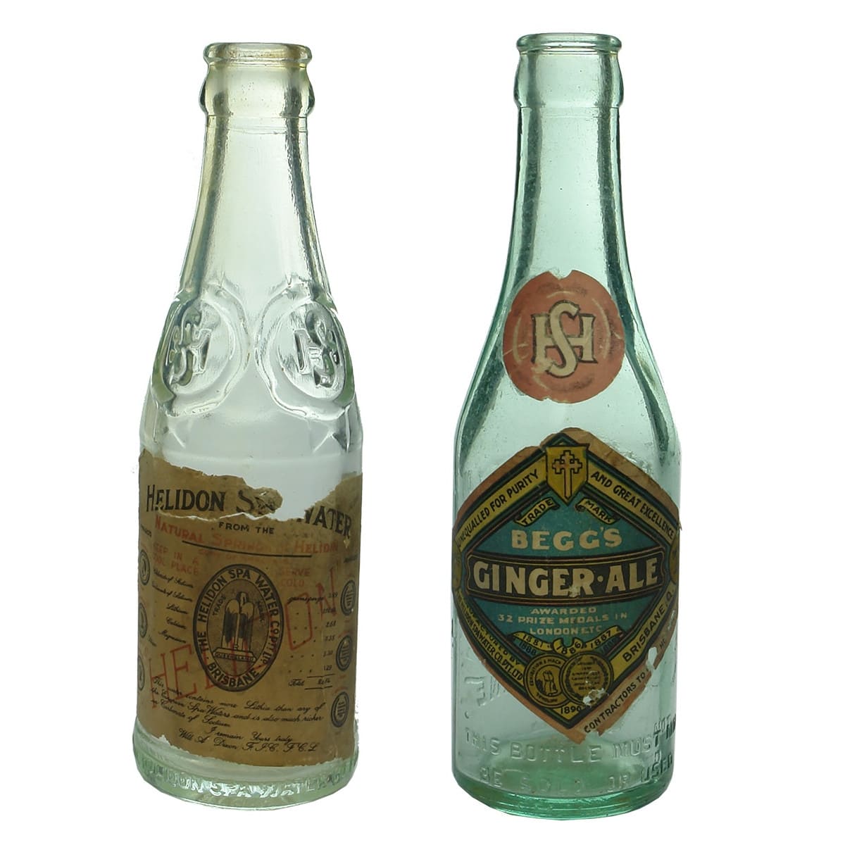 2 Crown Seals. Both Helidon Spa Water Co Pty Ltd Brisbane. Original Labels on both one for spa water and the other Begg's Ginger Ale. 6 oz. (Queensland)