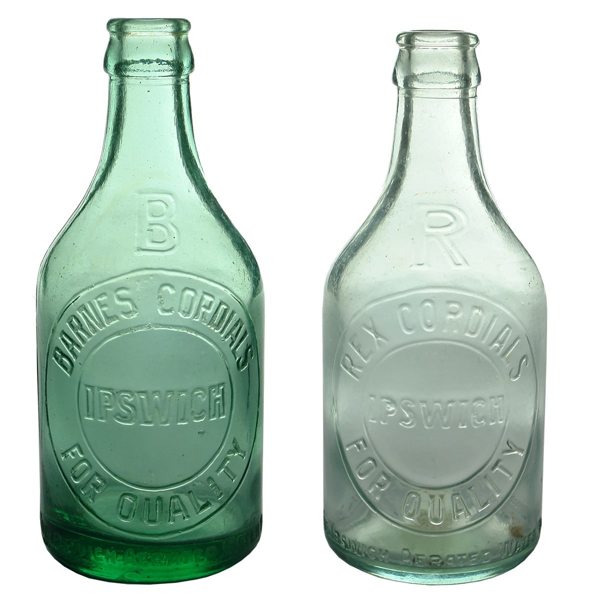 2 Ipswich Crown Seals. Barnes Cordials. Dark Lime Aqua & Rex Cordials Aqua. Both Dump shape. (Queensland)