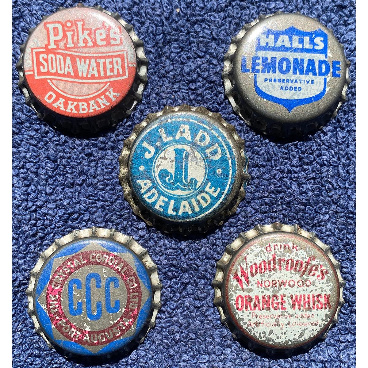 5 SA Crown Seal Caps: Crystal Cordial Co Port Augusta; Woodroofe's Orange Whisk; Hall's; J. Ladd, Adelaide; Pike's Oakbank. (South Australia)