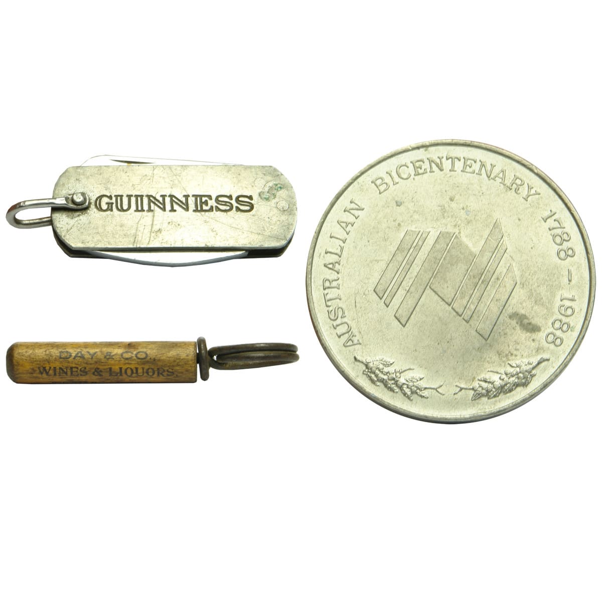 3 Items. 2 Openers & Medallion: Guinness Pocket Knife & Bottle Opener; Wines & Liquors Boston Massachusetts Corkscrew; Australian Bicentenary Education Medallion.