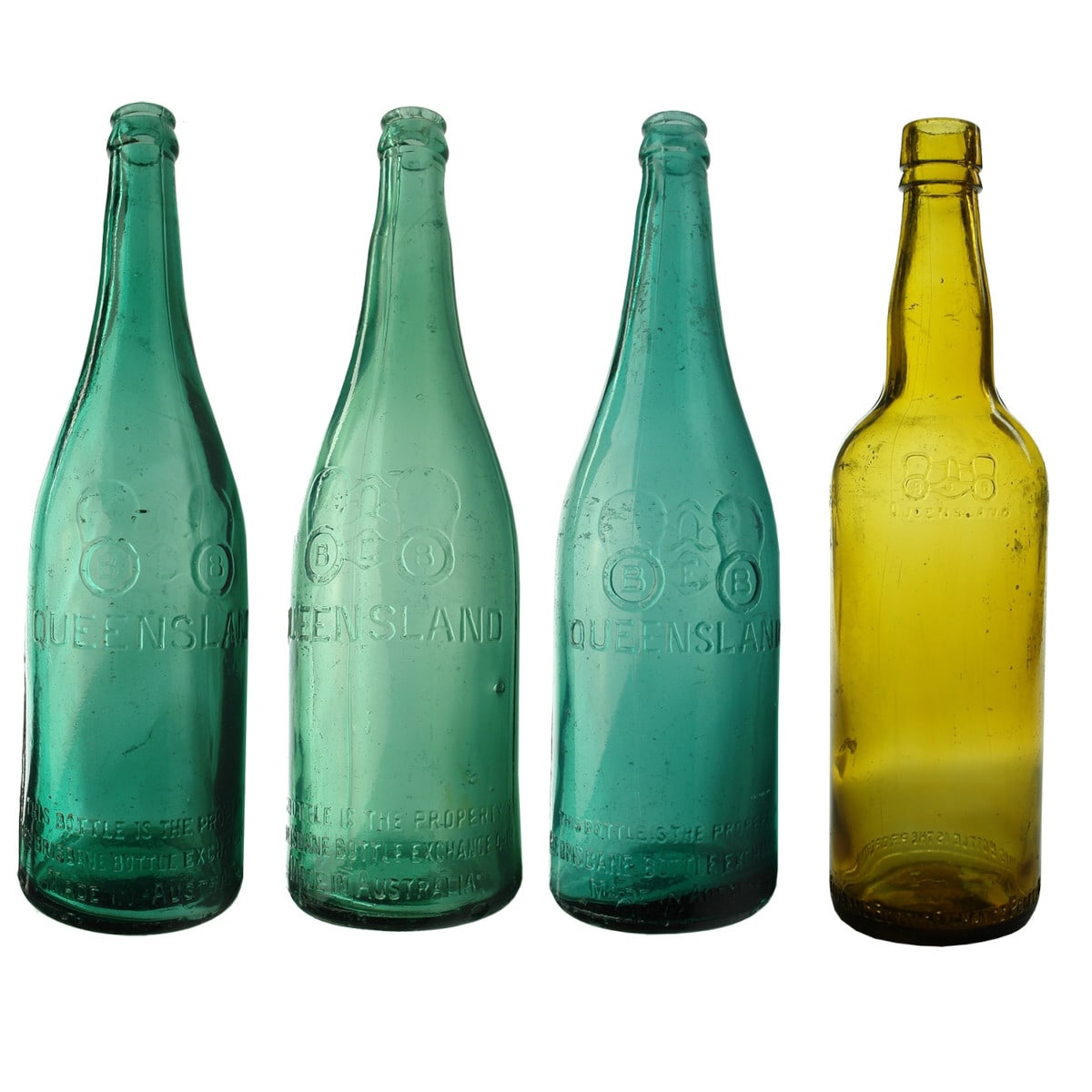 4 Brisbane Bottle Exchange Bottles. 3 x Turquoise/Green Crown Seal Beers; 1 x light amber cork top wine.