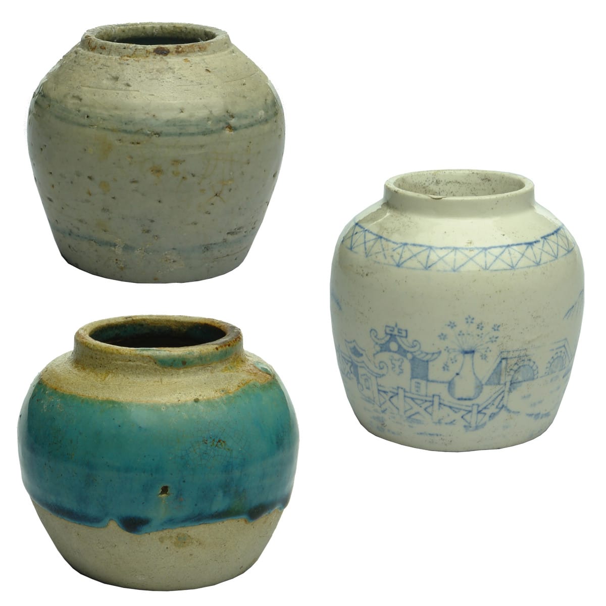 Chinese. Three ginger jars: 1. Round light grey jar with blue lines. 2. Round blue and white jar with mountains, bridge and buildings. 3. Round jar with drippy green glaze to upper body.