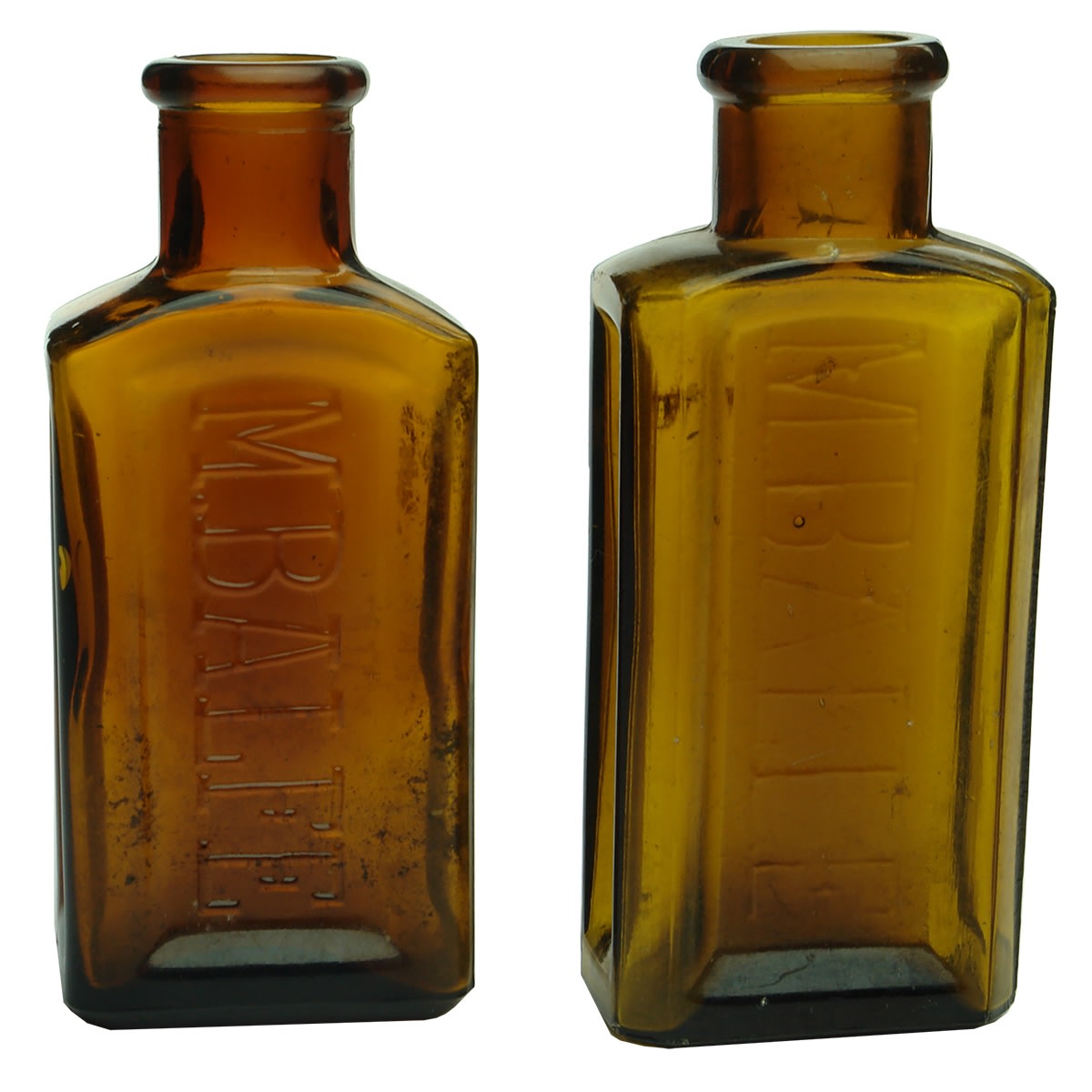 2 different amber M. Balfe Hat Dye bottles.