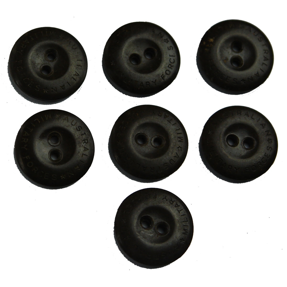 7 Bakelite or similar buttons. Australian Military Forces engraved to their edges.