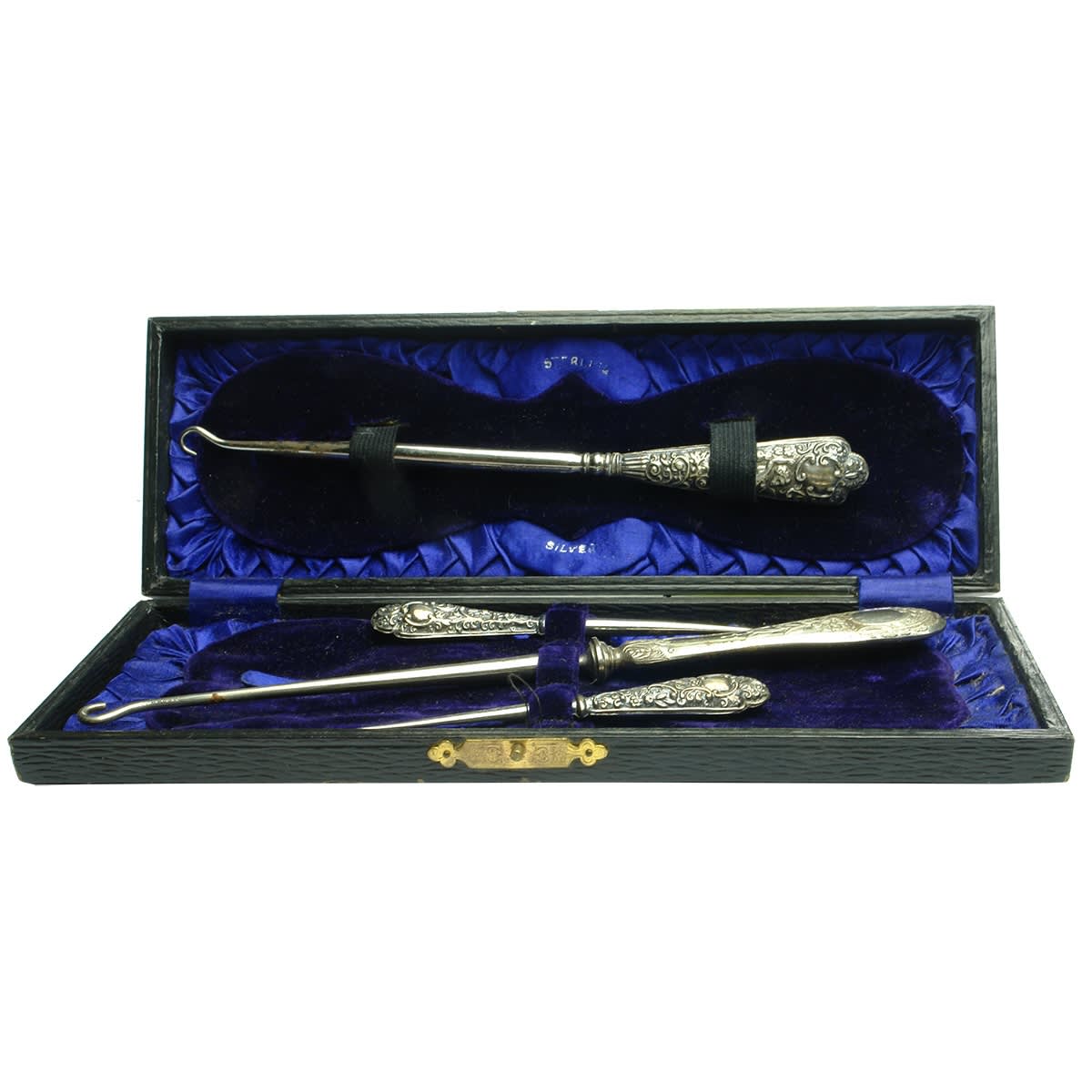 Metalware. Early boxed set of silverware including a couple of shoe button lace hooks.