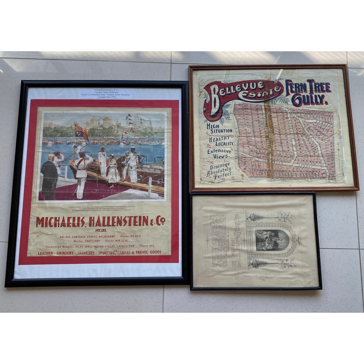 3 Framed original items: Michaelis Hallenstein & Co 1954 Queen Elizabeth Poster Bellevue Estate Fern Tree Gully real estate Nora C. Doig Williamstown 1923 Consecration certificate.