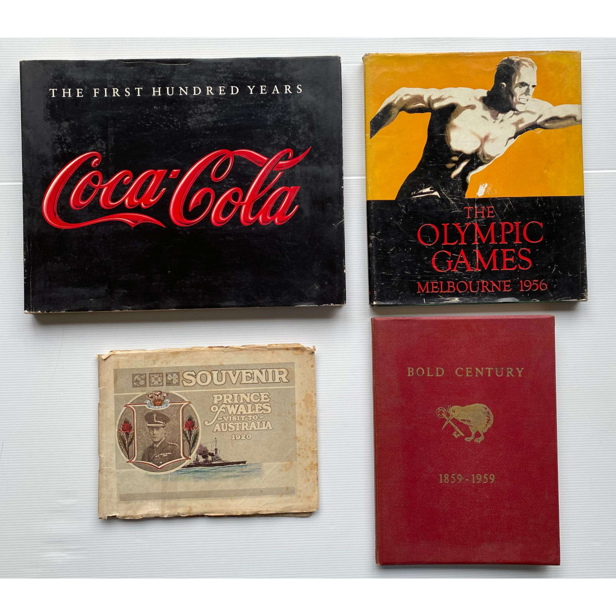 4 Books: Prince of Wales Visit to Australia 1920 Melbourne Olympic Games 1956 Coca Cola The First hundred years Bold Century History of NZ Insurance Co Ltd.