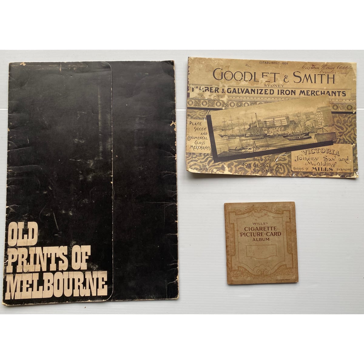 3 Items: 1. Folder. Old Prints of Melbourne. Reproduced 1886 woodcut prints of Melbourne scenes. 2. reprint of 1890 Goodlet & Smith, Sydney. Pottery etc. 3. Wills's CIgarette Picture Card Album. Household Hints. 50 cards complete.