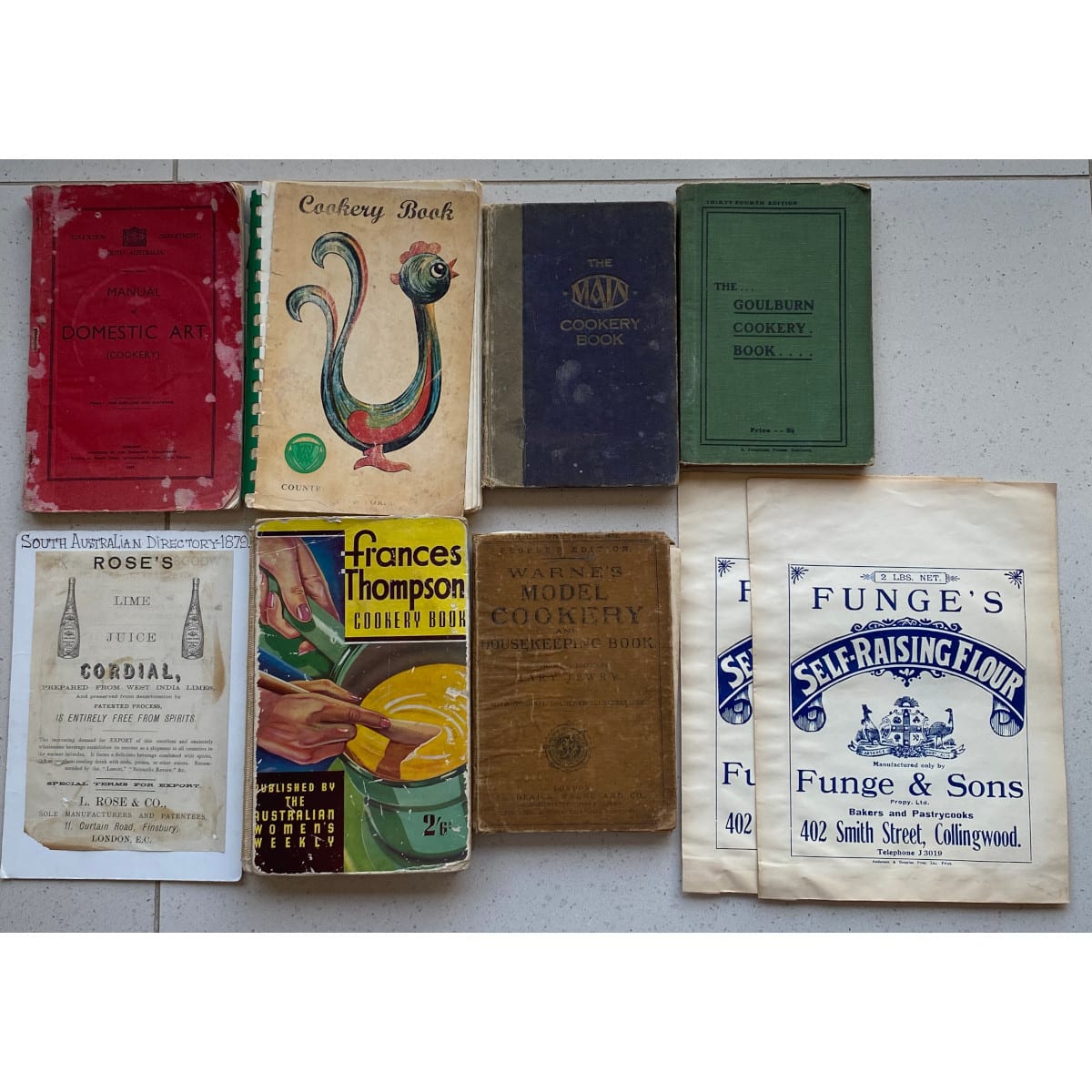 9 Items: 6 Cooking Books of various vintages 2 Paper Flour Bags from Funge & Sons, Collingwood 1879 Advert for Rose's Lime Juice Cordial.