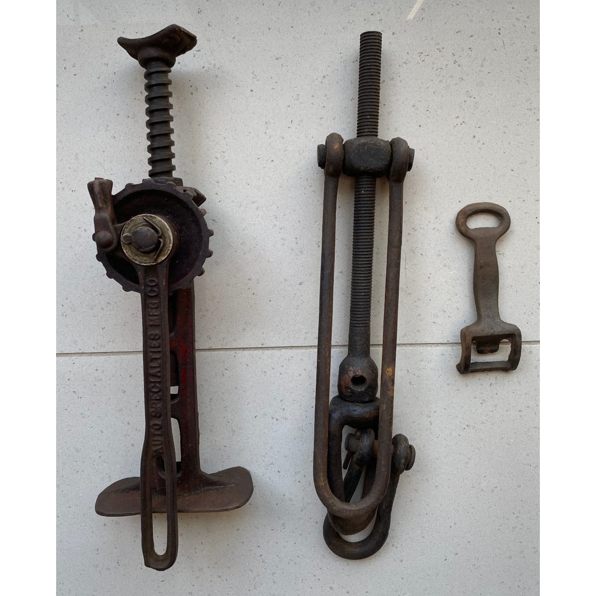 3 Cast Iron Pieces and a wooden barrel tap: Early Car Jack A...connector! and a heavy bottle opener.