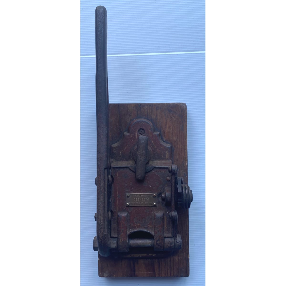 Tobacco Cutter. The Little Champion, Patented throughout the world! Cast Iron mounted on wood.