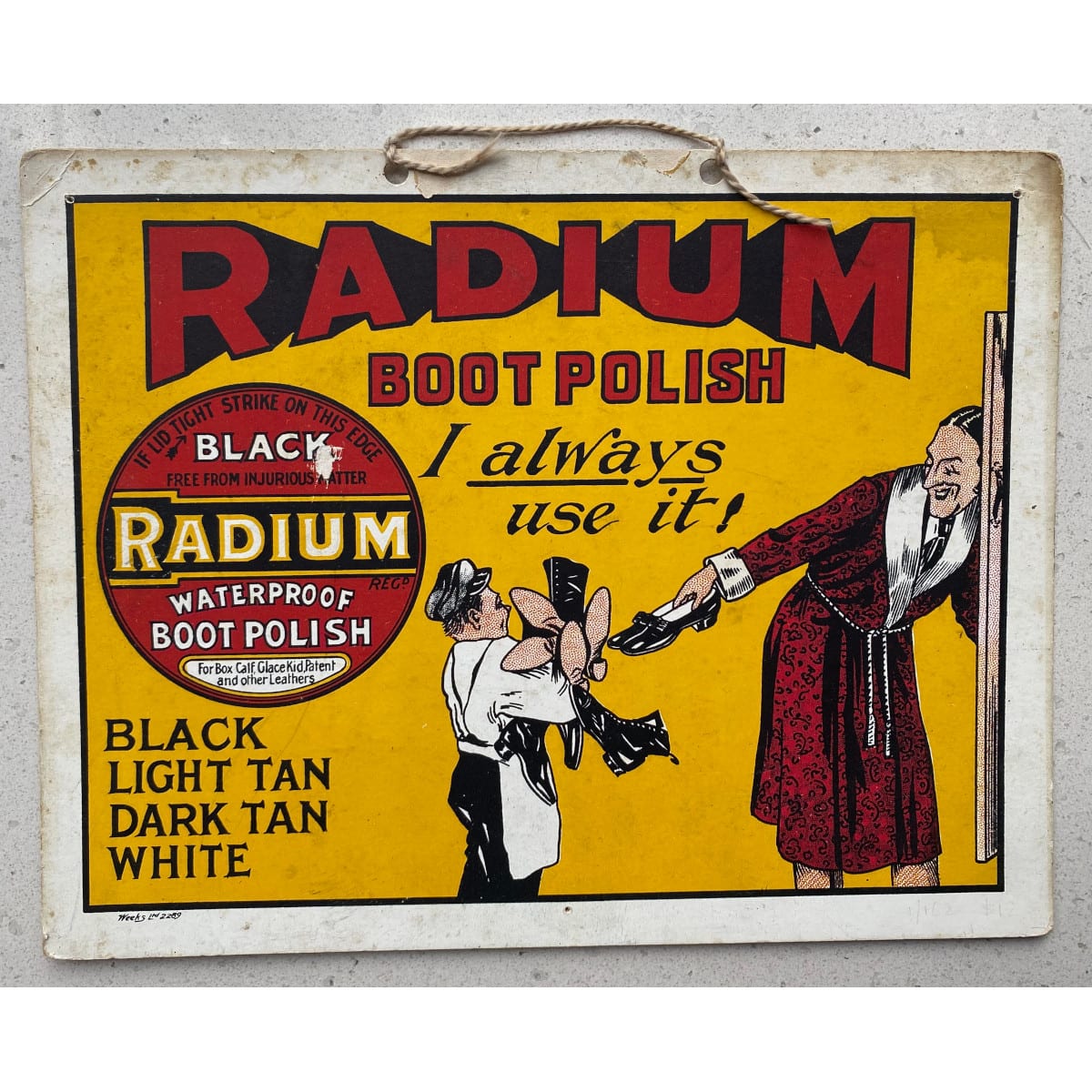 Cardboard Advertising Sign. Radium Boot Polish. I always use it. Man handing all his shoes to a shoe shine man. Tin of Black Poot Polish. Use Radium Polishes to back.