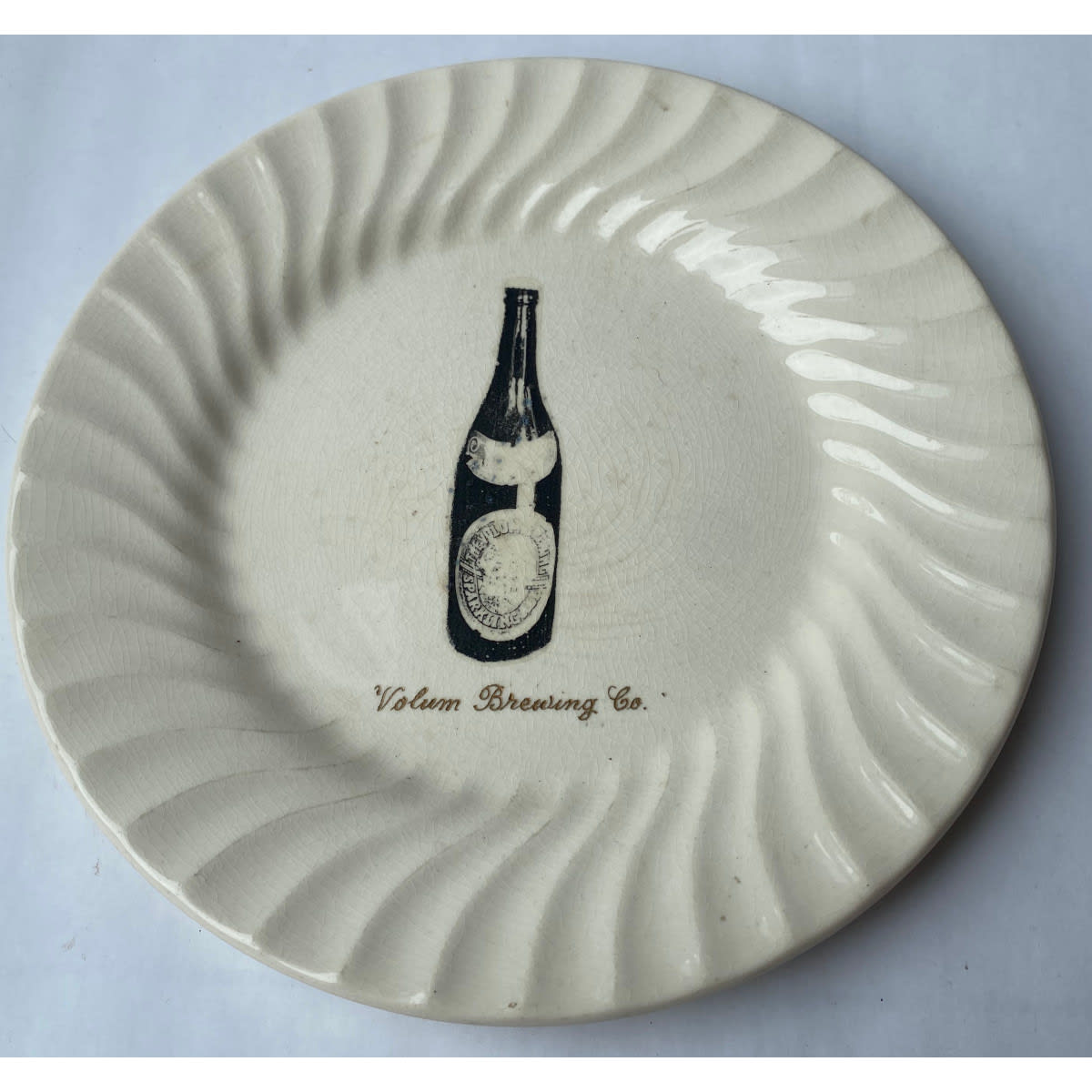 Plate with decal picture of  labelled Volum Brewing Co crown seal beer and engraved Volum Brewing Co. at lower front. Johnson of Australia pottery. (Geelong)