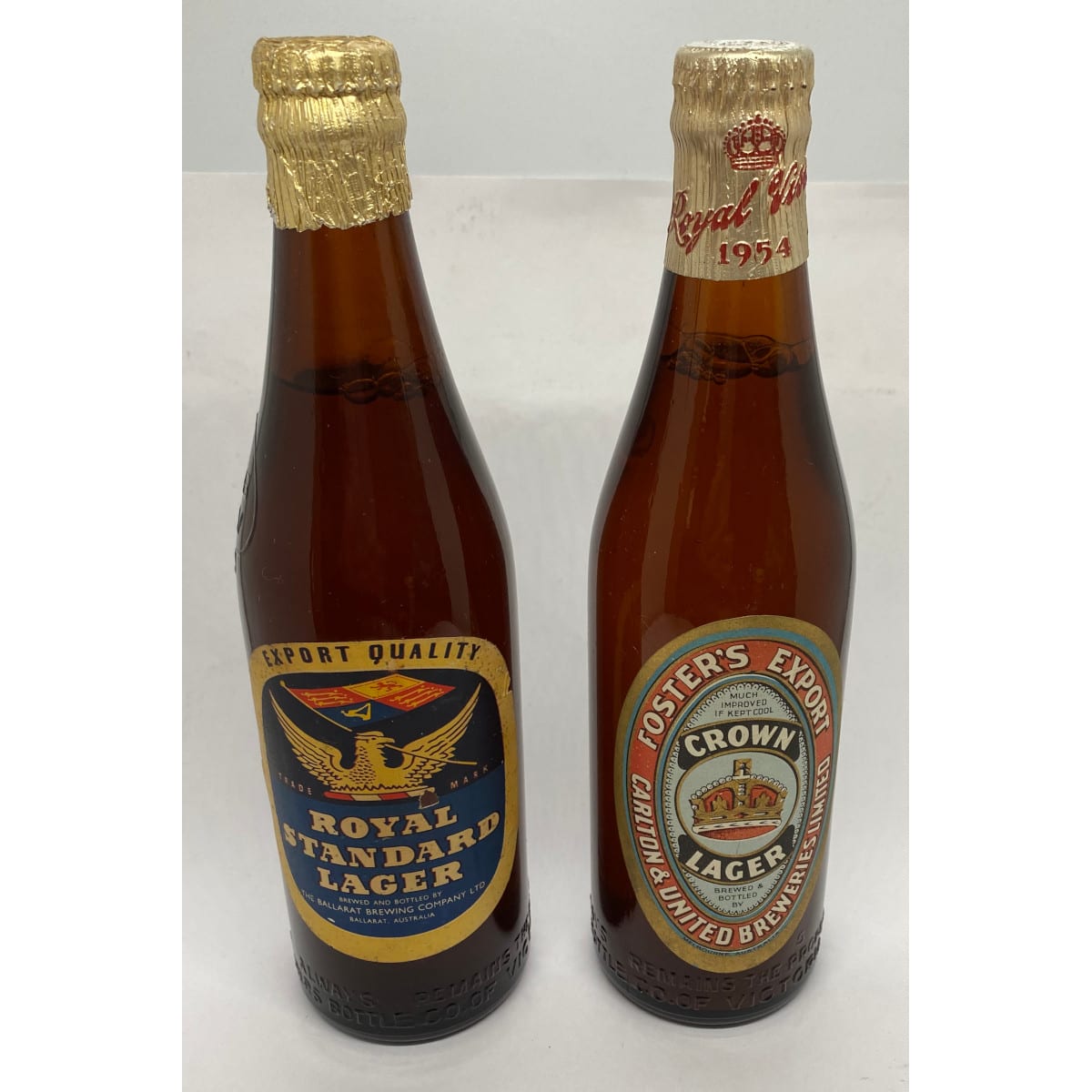 2 Crown Seal Beers. Royal Standard Lager, Ballarat Brewing Co and Foster's Export Crown Lager Royal Visit 1954. Carlton & United Breweries Ltd. Original Labels, Caps, Foil and contents. (Victoria)