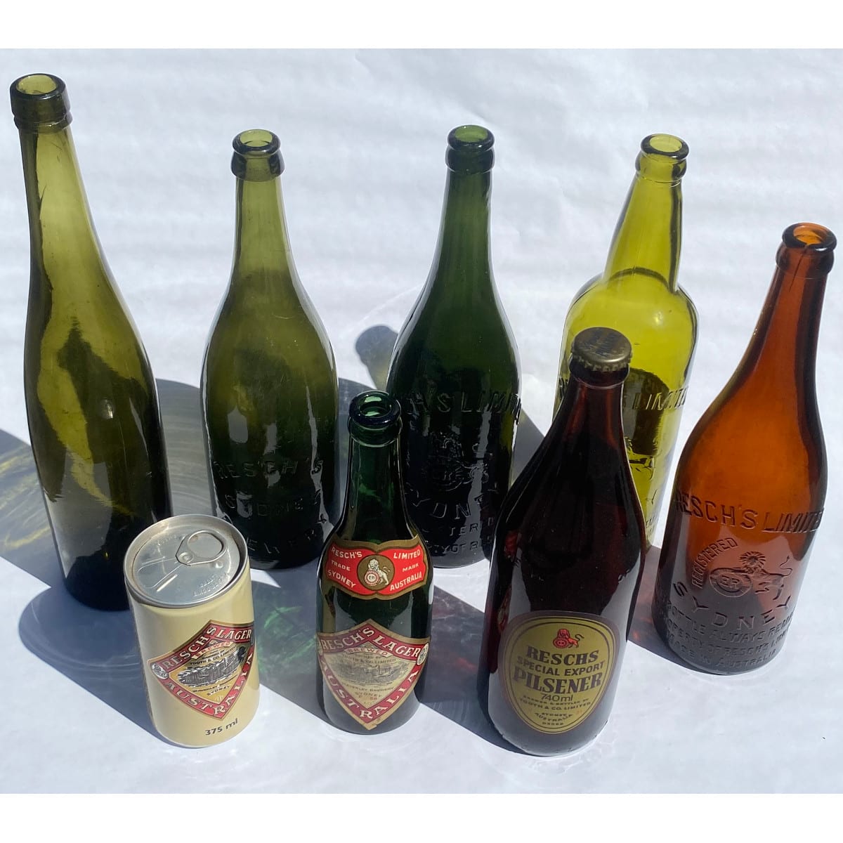 8 Reschs Items: Base embossed beer Sydney Brewery applied crown seal 3 Resch's Limited Crown seals (1 with label added) Small plain c/s with labels added 1970s Pilsener Can commemorating closure of Waverley Brewery 1983. (New South Wales)