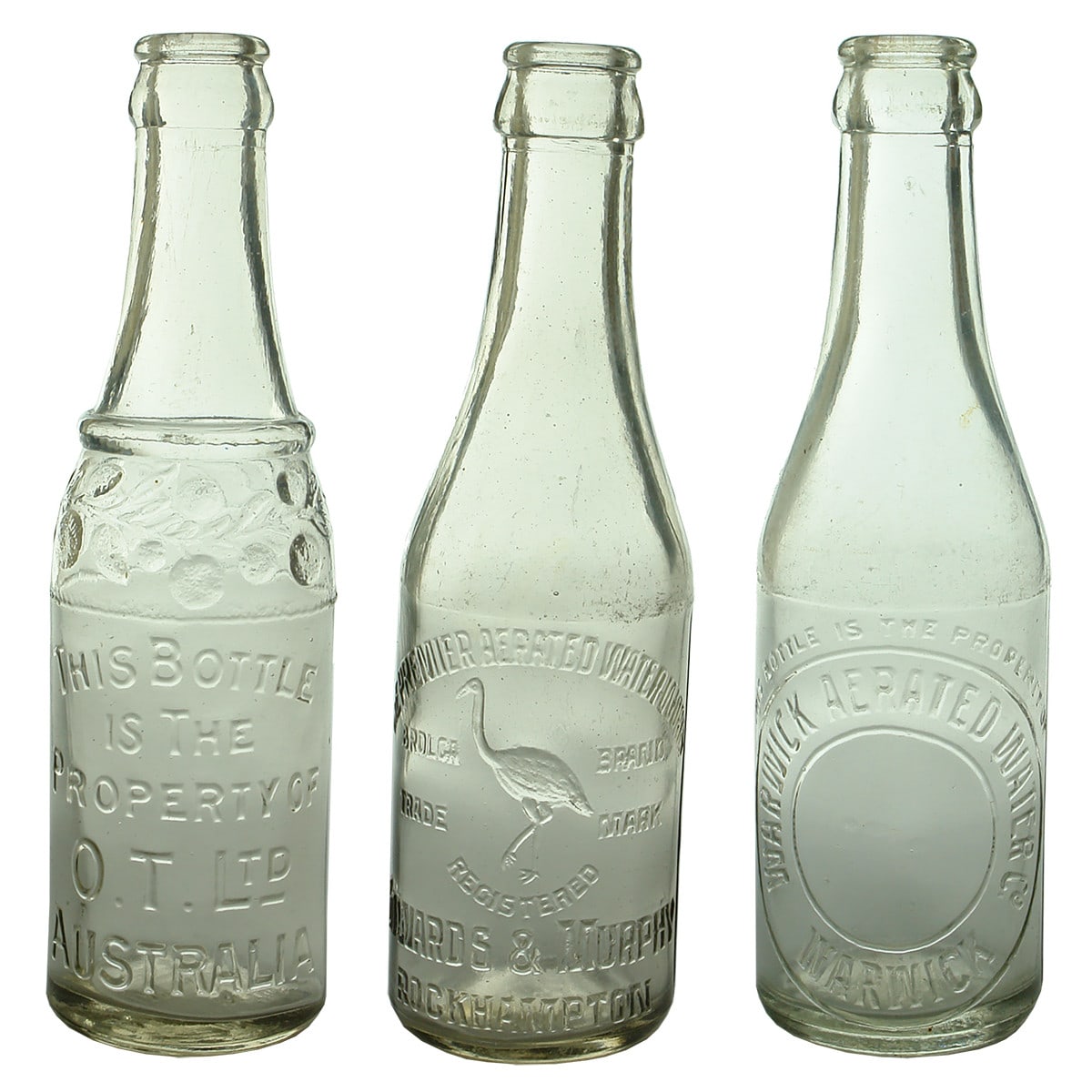 3 Crown Seals. O. T. Ltd Australia. Fruit decoration to shoulder; Premier Aerated Waters, Edwards & Murphy, Rockhampton; Warwick Aerated Water Co. Clear. 6 oz.