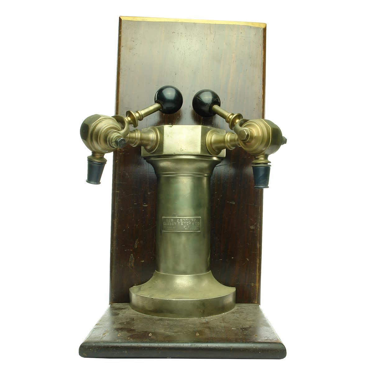 Soda Fountain Displenser. New Century Cawsey Menck & Co, Sydney & Melbourne. Brass, two nozzles. Mounted on solid timber. (New South Wales & Victoria)