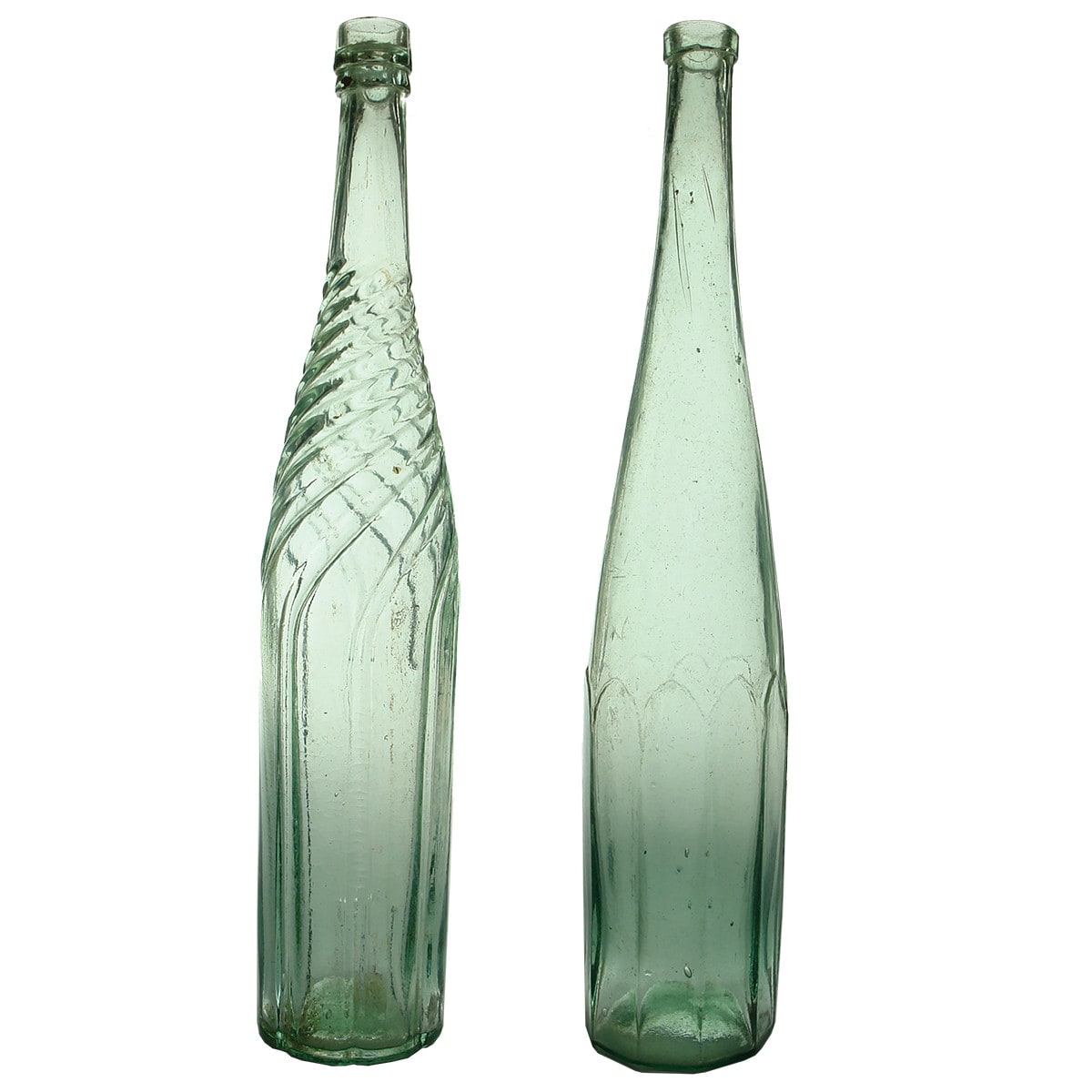 2 large "Goldfields" bottles: Twisted spiral design to neck; Ten sided salad oil with long neck.