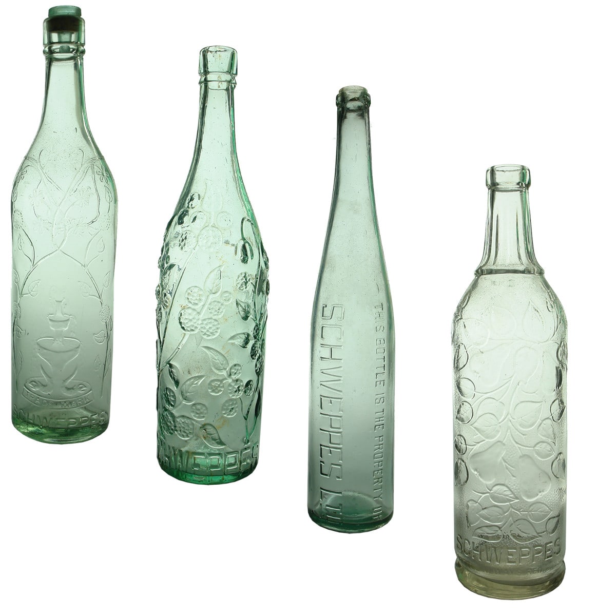 4 different Schweppes Cordials. Fish and Fountain. Aqua. 26 oz; Fruit and Vines. Aqua. 26 oz; Schweppes Ltd. Z base mark. Very tall 26 oz; Fruit and Vines. Clear. 26 oz.