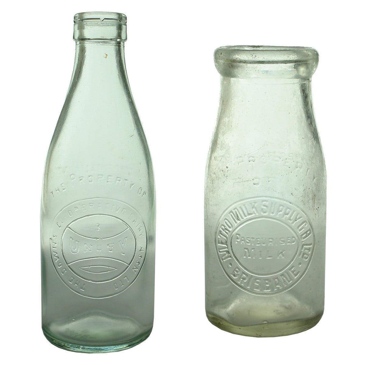 2 Milk Bottles: The Downs Co-operative Dairy Association Unity Foil top Pint; Metro Milk Supply Brisbane Half Pint. (Queensland)