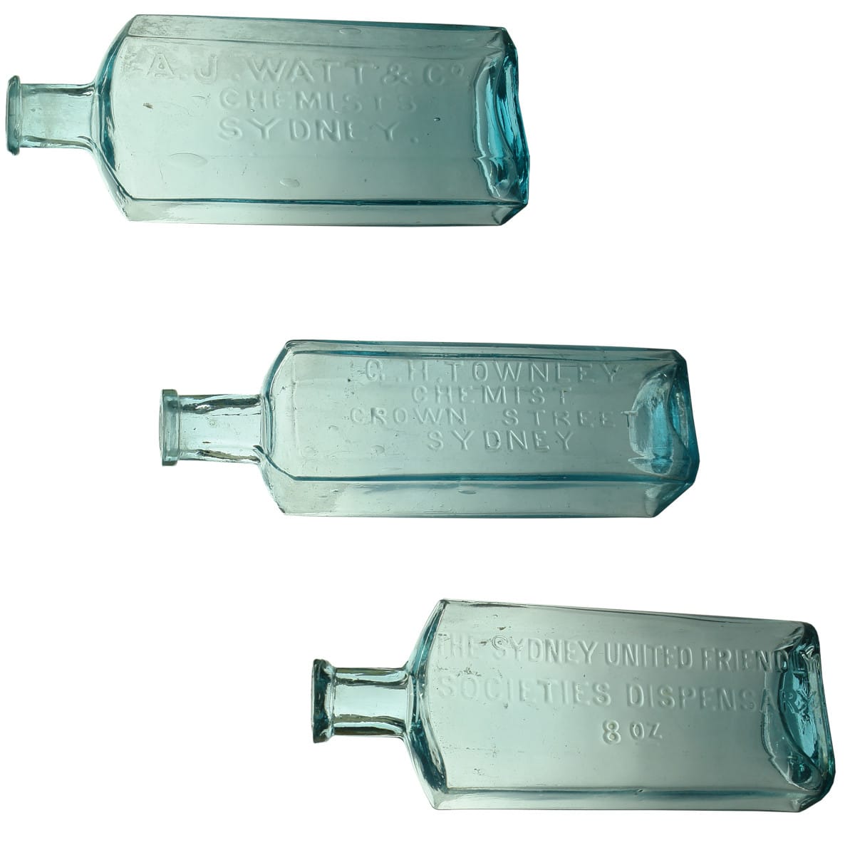 3 Chemists. A. J. Watt & Co, Sydney. Thin lip. Ice Blue. 8 oz. 164 mm; G. H. Townley, Crown Street, Sydney. Tall square. 8 oz. 170 mm; The Sydney United Friendly Societies Dispensary. 8 oz. M base mark. 162 mm. (New South Wales)