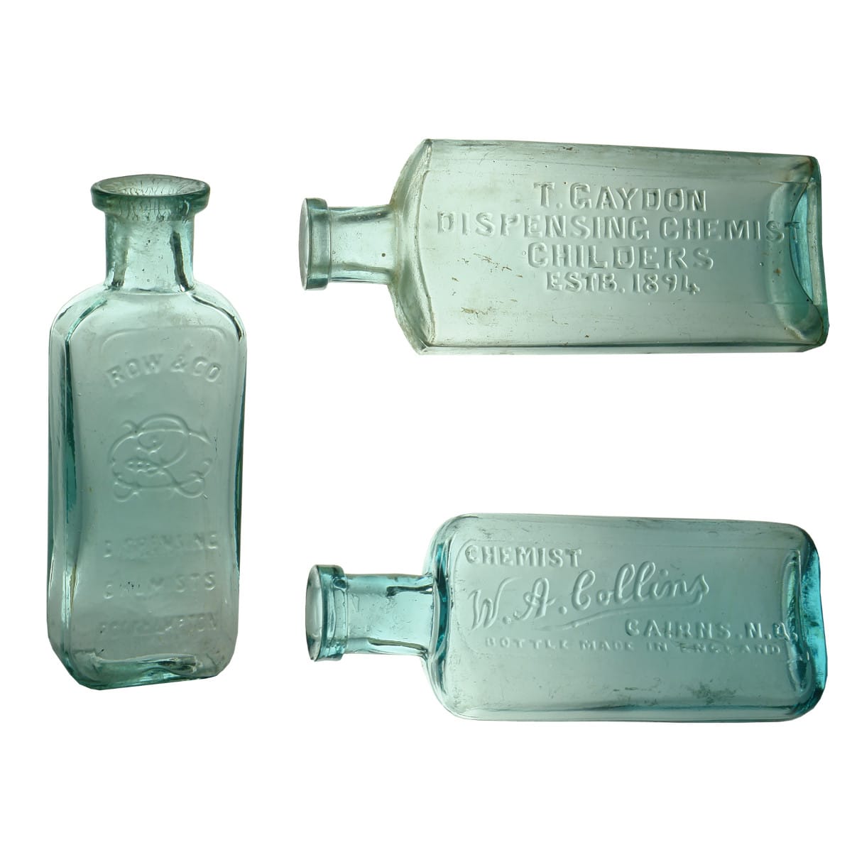 3 Chemists. T. Gaydon, Childers. Established 1894. Aqua. 3 oz. 130 mm; W. A. Colins, Cairns. Maws base mark. Aqua. 1.5 oz. 109 mm; Row & Co. Rockhampton. Monogram. Aqua. 1 oz. 93 mm. (Queensland)
