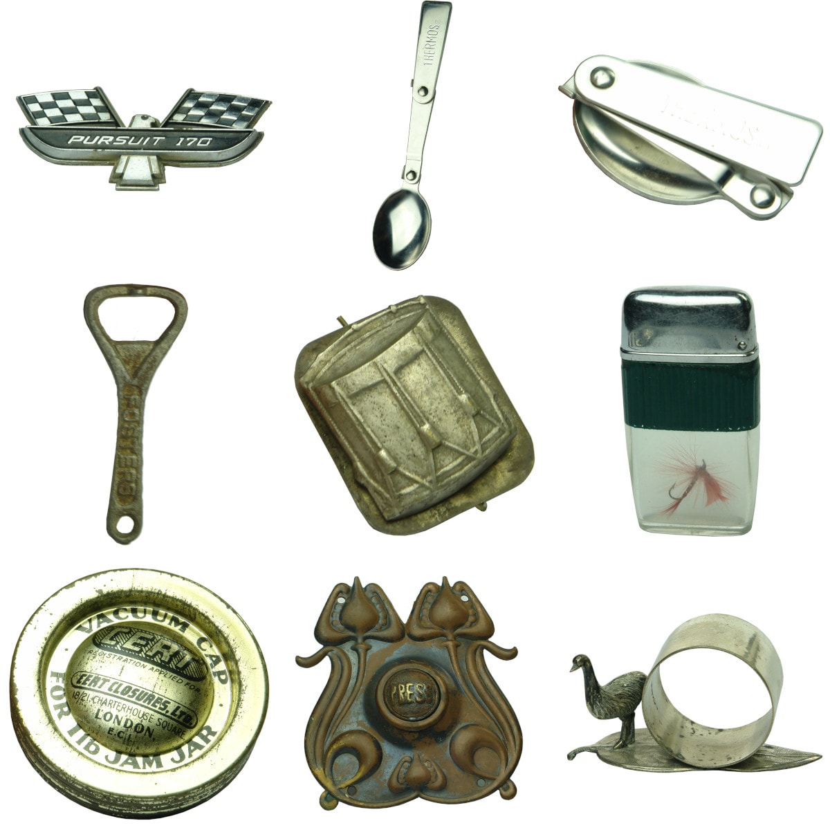Group of Metalware. Pursuit 170 car badge; Fold out Thermos spoon; Fold out Thermos spoon; Fosters Lager Bottle Opener; Brooch with Drum; Castor Cigarette Lighter with Fishing Fly Inside; 8 x CERT Vacuum Caps For 1 Lb Jam Jars; Copper Push Button Door Bell; E. P. N. S. Emu Serviette Ring.