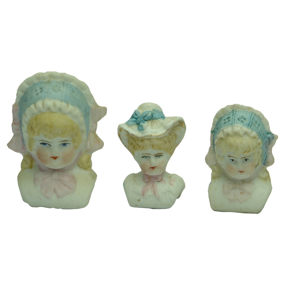Dolls. Three different bonnet dolls.