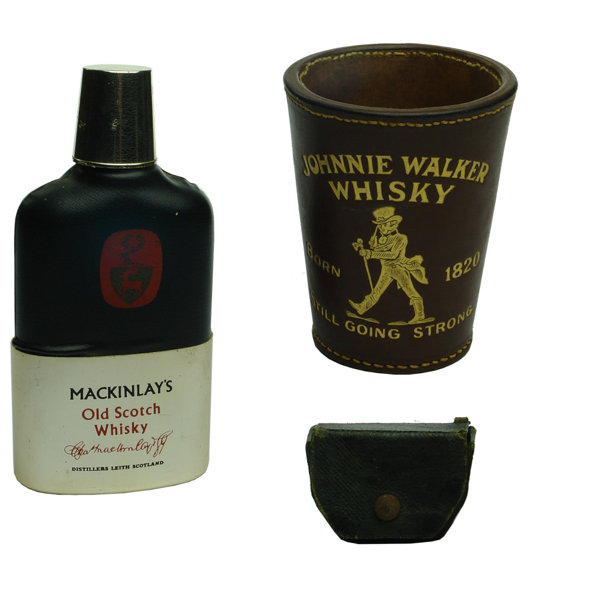 2 Whisky Items: Mackinlay's Flask with metal holder, nip glass and dice in bottom. Johnnie Walker Leather cup and dice.