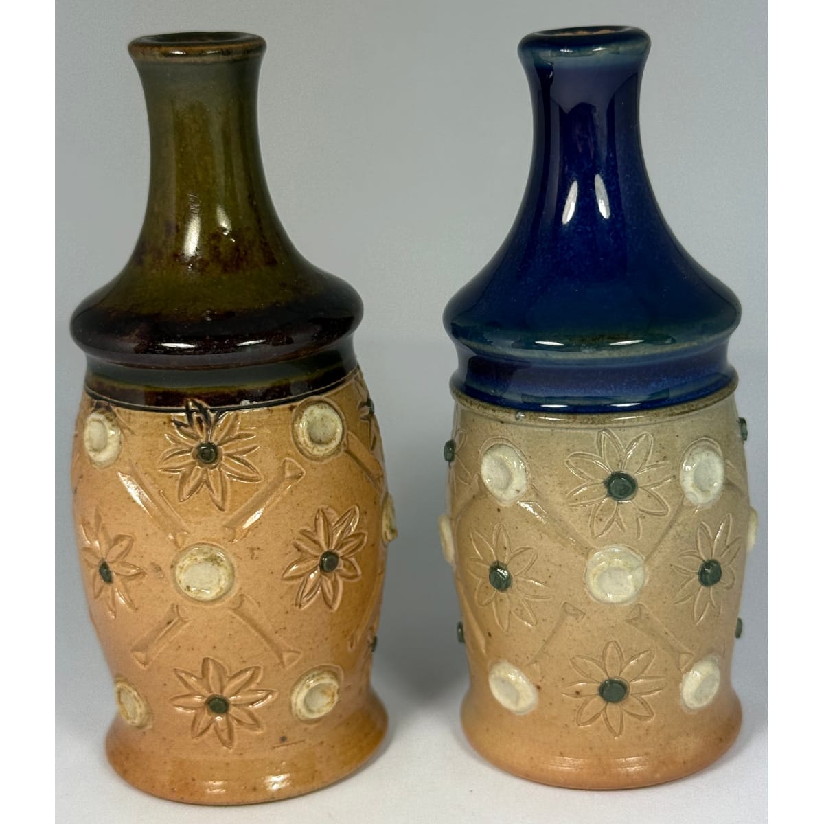 Pair of Miniature Royal Doulton vases. Floral patterns. Blue top and Green top.