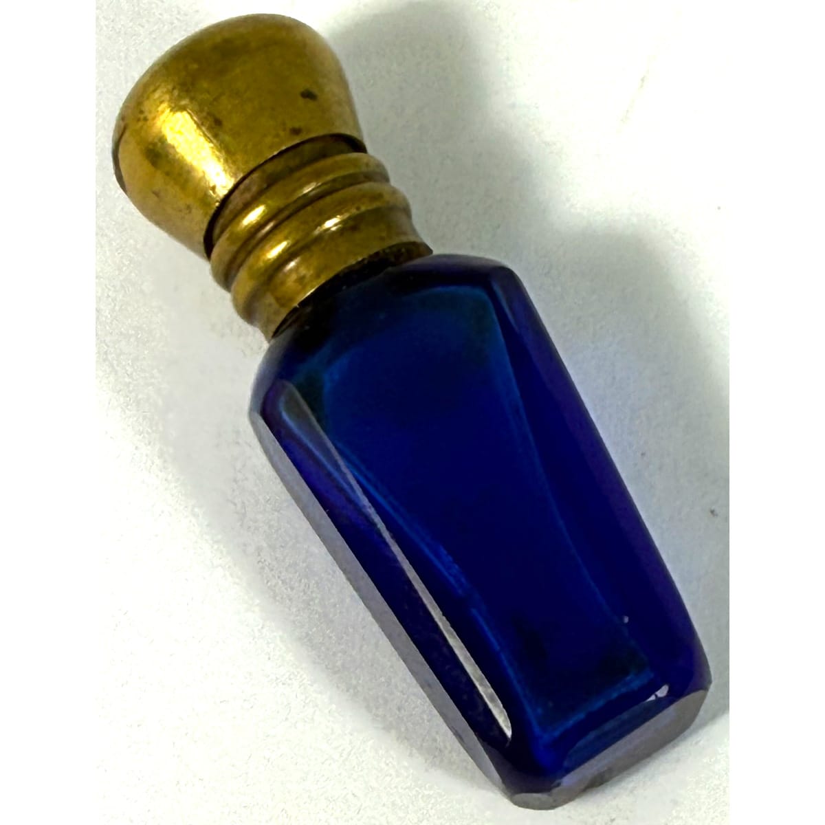 Super tiny cut glass scent or perfume. Cobalt blue. fitted brass cap. 38 mm with cap.