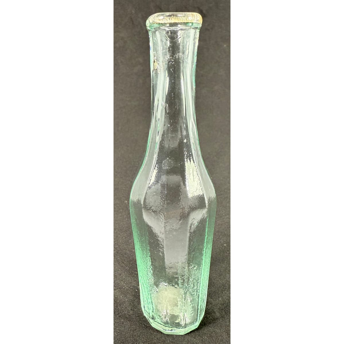 Sample Goldfields Salad Oil. 12 sided. Crude rolled lip. Large tube pontil scar to base. 132 mm tall.