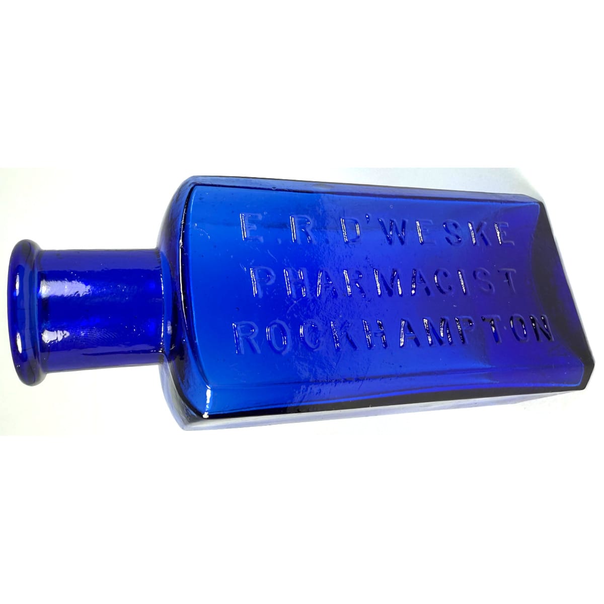 Chemist. E. R. D'Weske, Pharmacist, Rockhampton. Small wide mouth cobalt blue bottle. 3 oz. 125 mm. (Queensland)