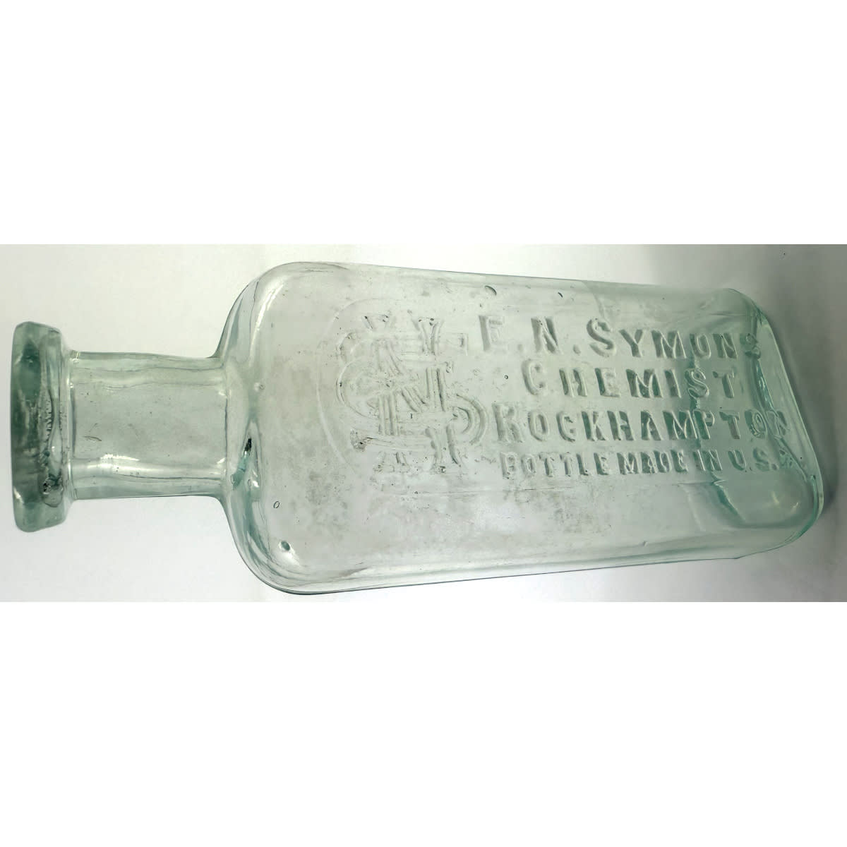Chemist. E. N. Symons, Rockhampton. Whitall Tatum. Manhattan Oval shape. Aqua. 2 oz. 109 mm. (Queensland)