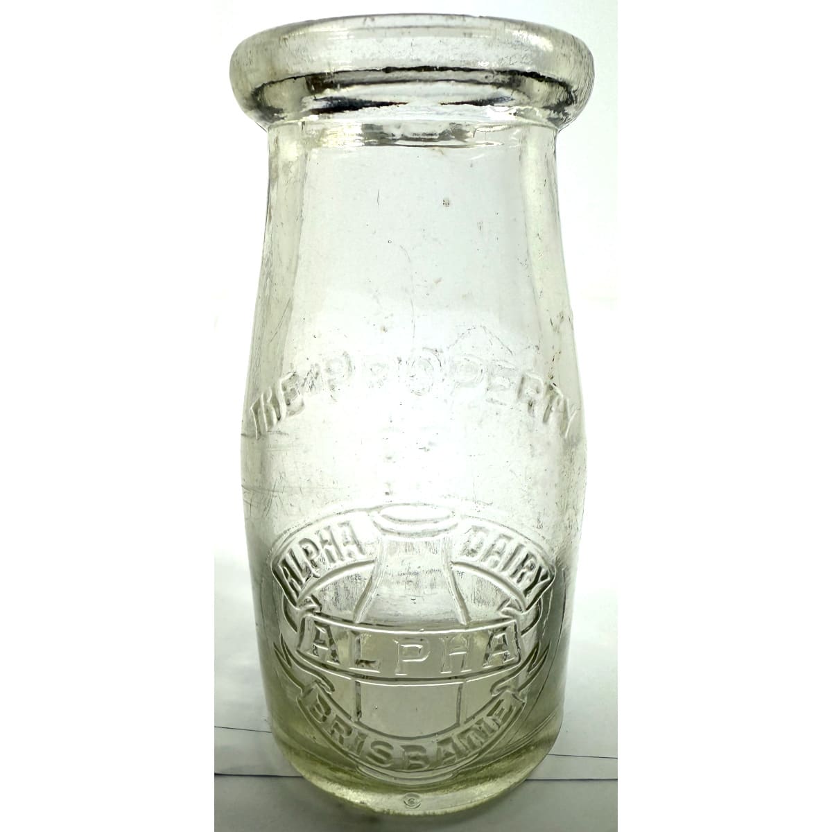 Cream. Alpha Dairy, Brisbane. Bottle Pictorial. Wad lip. 1/4 Pint. 115 mm. (Queensland)