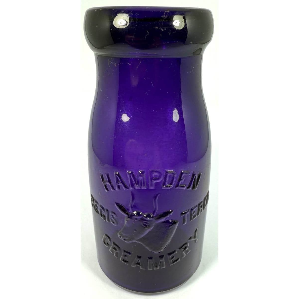 Milk. Hampden Creamery. Cows Head. "Zapped" to a Dark Purple. Half Pint. 133 mm. (USA)