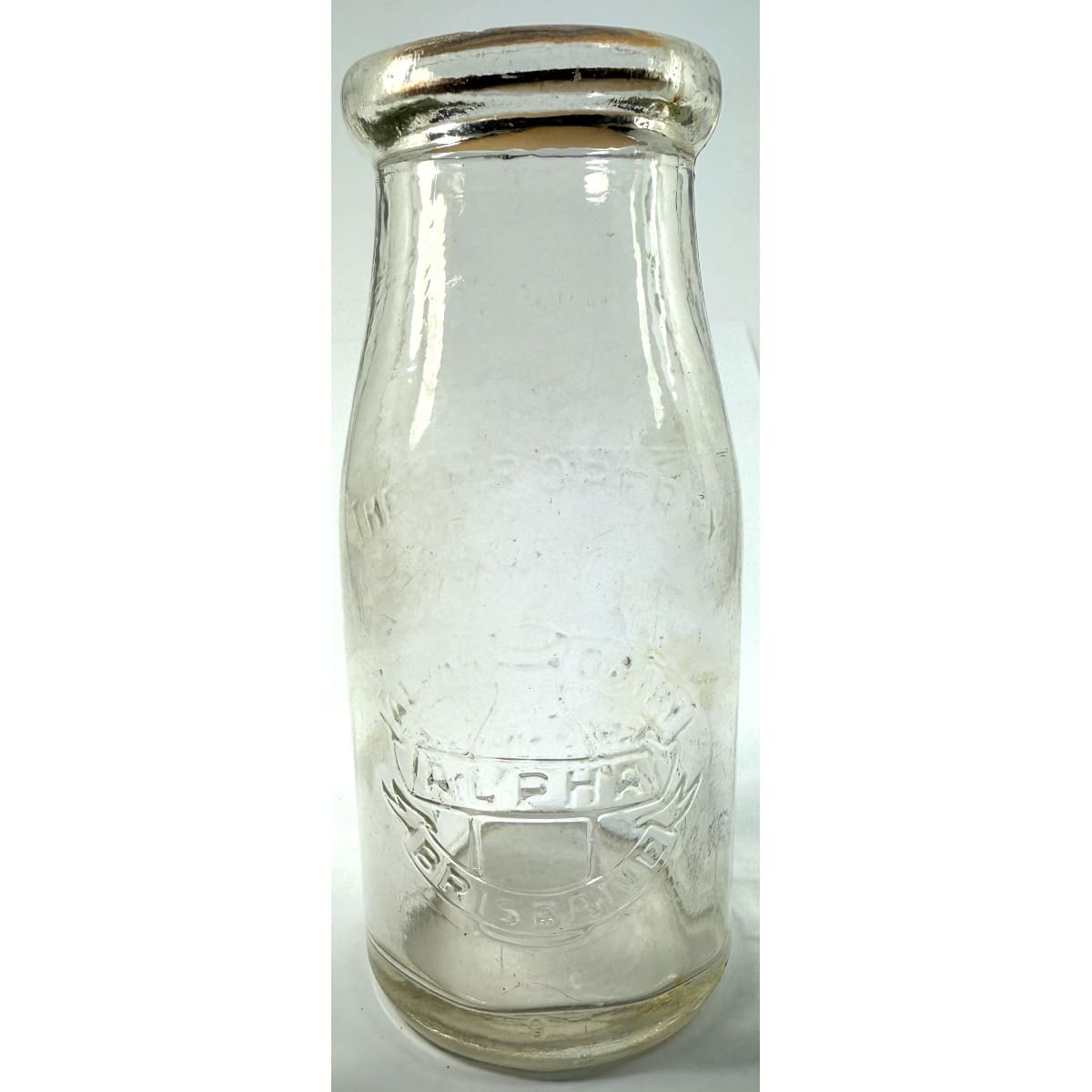 Milk. Alpha Dairy, Brisbane. Bottle Pictorial. Wad lip. 1/2 Pint. 147 mm. (Queensland)